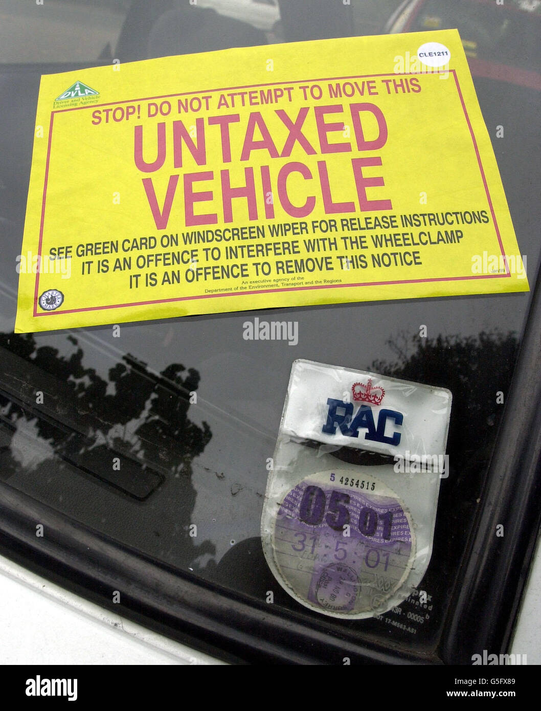 An unlicensed vehicle sits in a lay-by on Chelsea Embankment in London after being clamped in a new initiative by police and Driving and Vehicle Licensing Agency staff to coincide with the launch of the new Stingray camera systems which detect untaxed vehicles on the road. Stock Photo