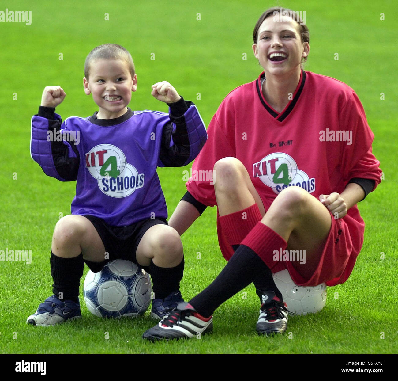 Five-year-old Jake Lunn from Ashford, Kent, with model Kate Groombridge during the launch of Kit 4 Schools at Tottenham's White Hart Lane ground in London. * .... Kit4Schools is a new campaign that aims to offer children across the country the chance of having new soccer kits donated to their schools for free. Stock Photo