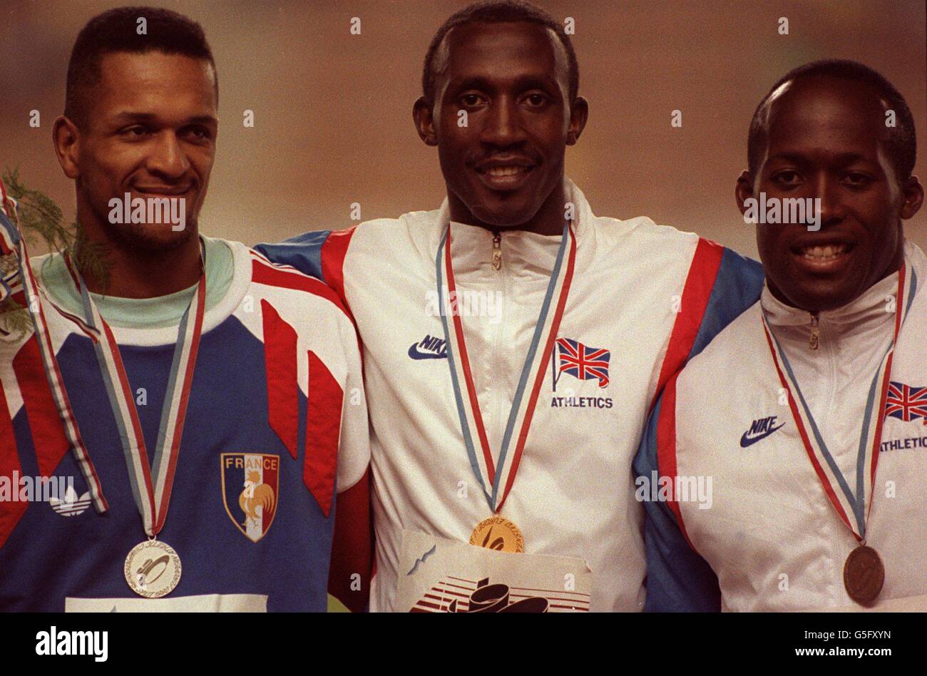 100m MEN MEDALS; l-r; DANIEL SANGOUMA [FRANCE] silver, LINFORD CHRISTIE [GB] gold, JOHN REGIS [GB] bronze. Stock Photo