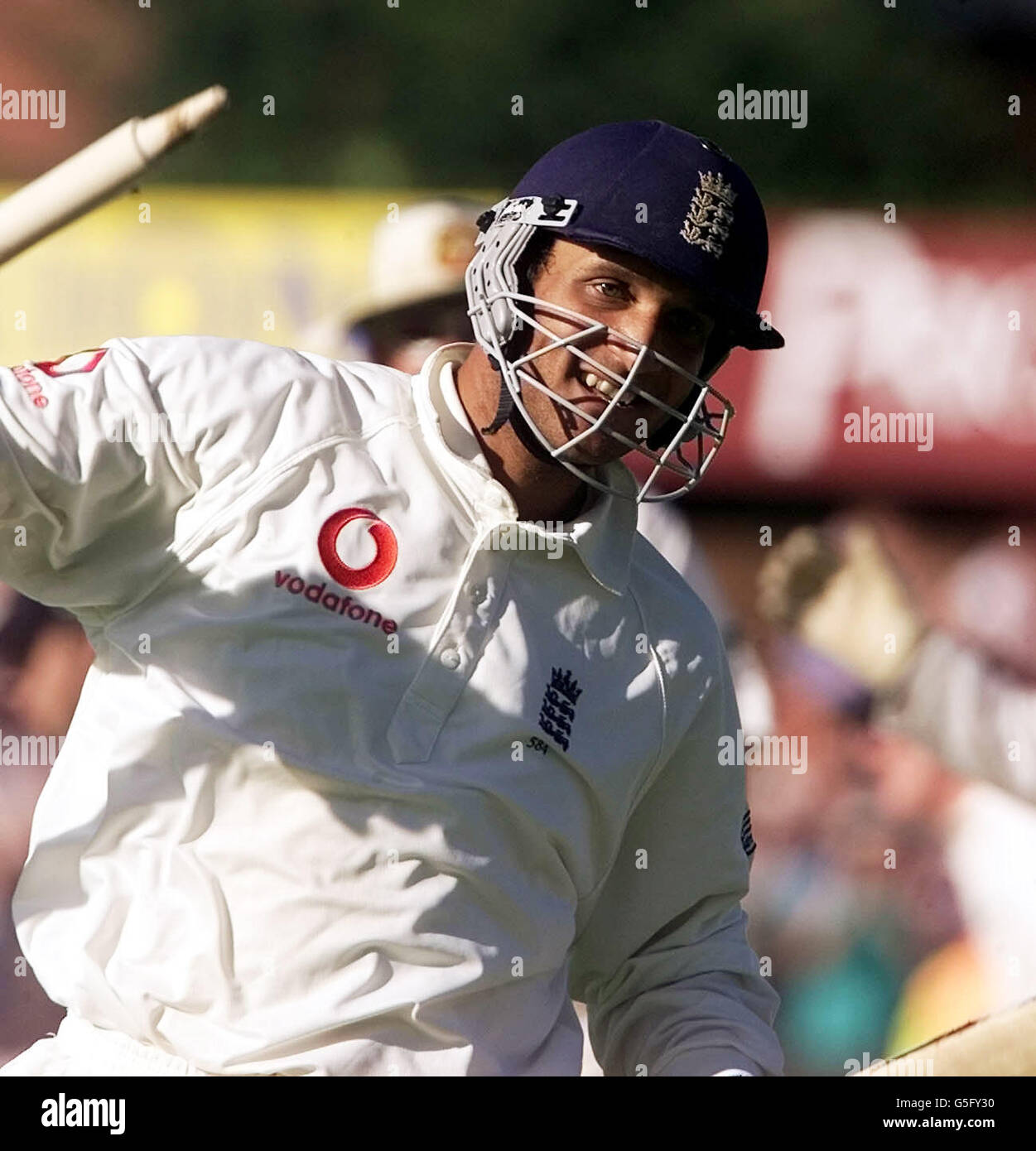 England's Mark Butcher celebrates whilst walking off after hitting the ...