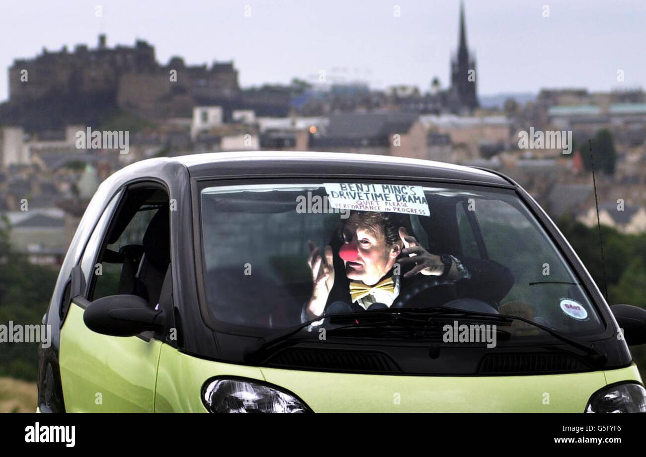 Benji Ming, 43, at the Edinburgh Festival Fringe, performing the smallest play in the world 'Drivetime Drama' which is performed in his car as he drives along. His play is in defiance of police and council officials who denied Mr Ming an entertainment licence. * due to safety fears about his performance. Stock Photo