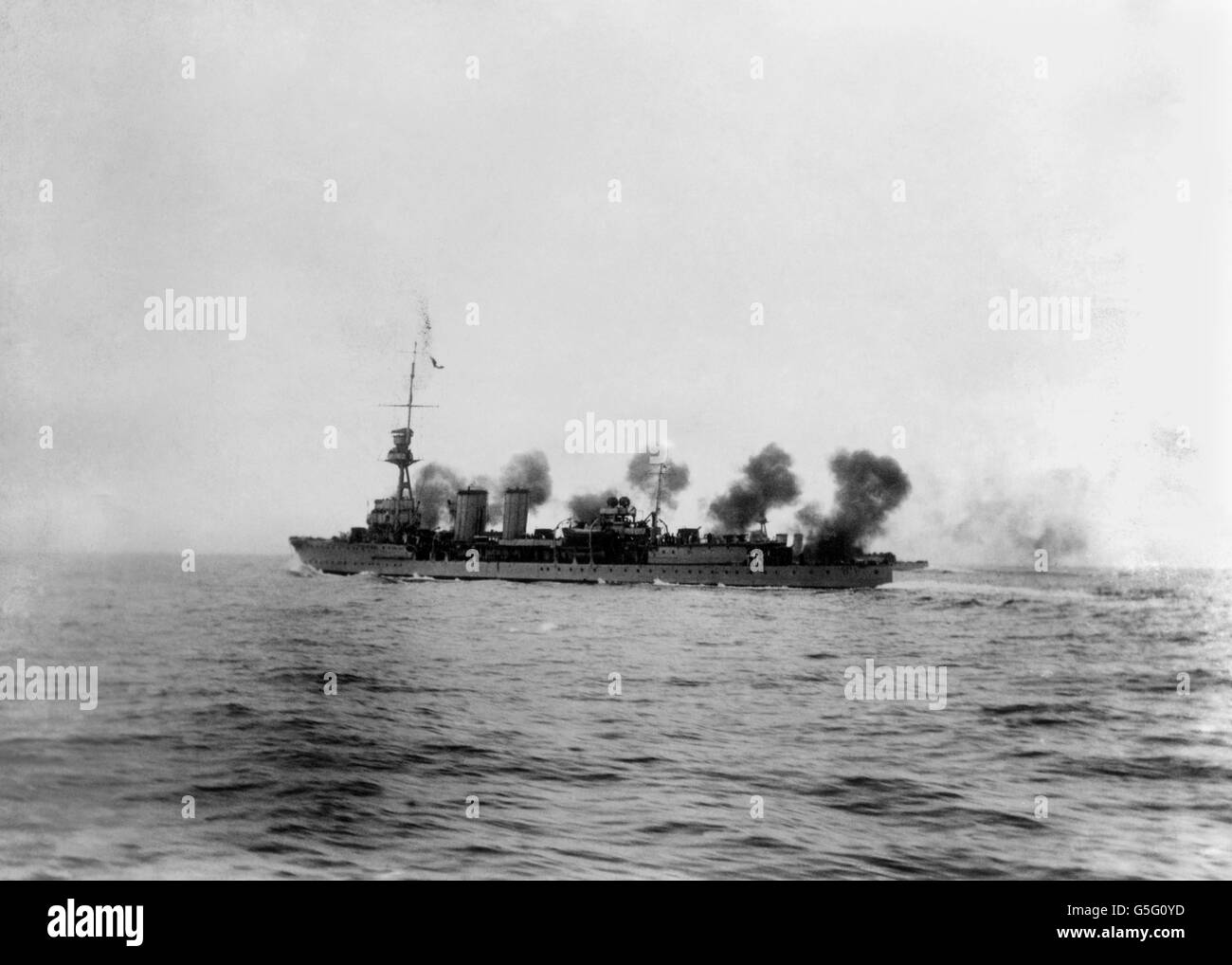 HMS Centaur firing a salvo. 1919. Stock Photo