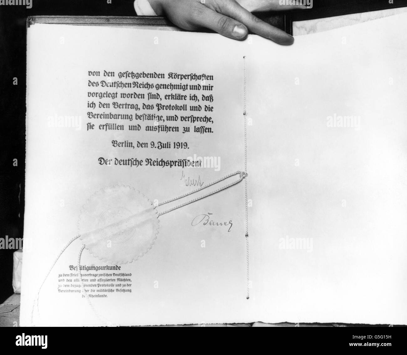German translation of the 1920 peace treaty, signed by Herr Ebert and Herr Bauer. Stock Photo