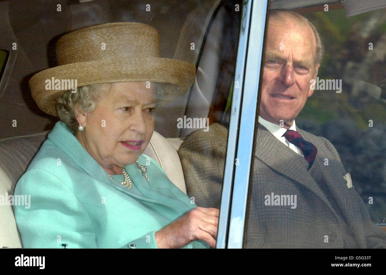 Queen Elizabeth II and the Duke of Edinburgh arrive at Crathie near the Balmoral Estate in Scotland for the morning service. Stock Photo