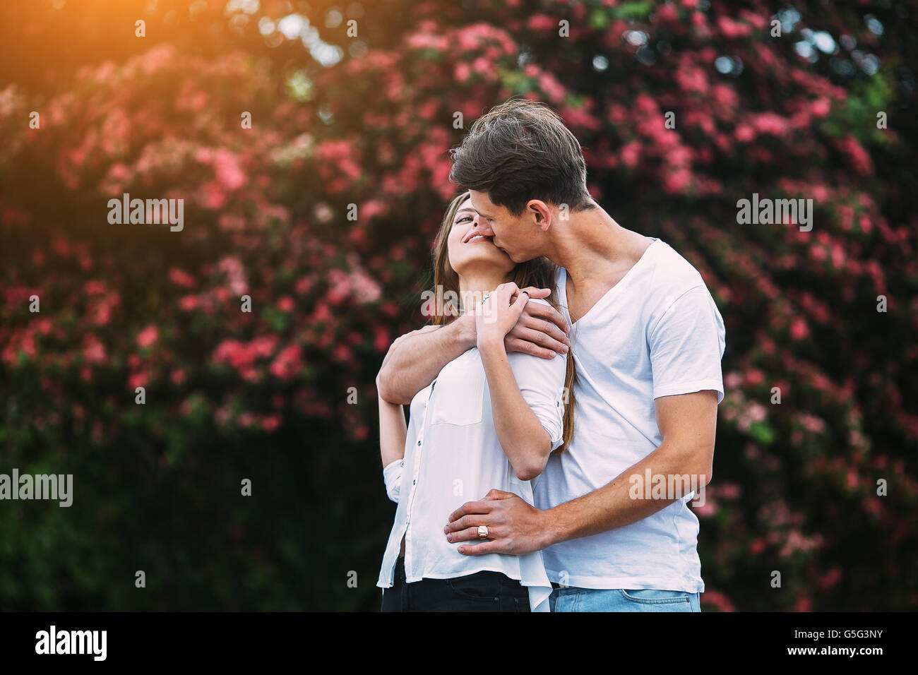 Young happy couple in love outdoors Stock Photo - Alamy