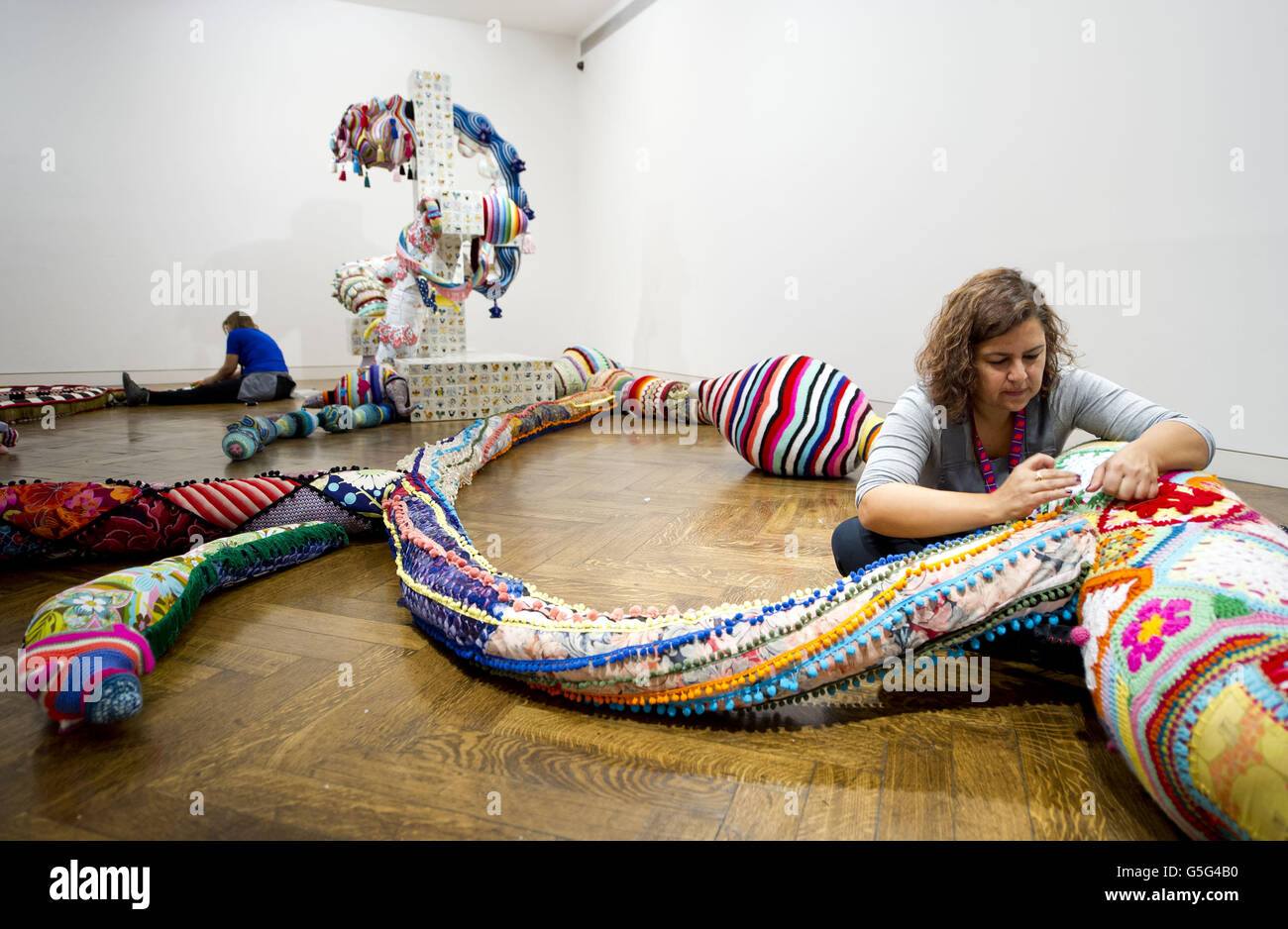 Portuguese artist Joana Vasconcelos puts the finishing touches to her ...