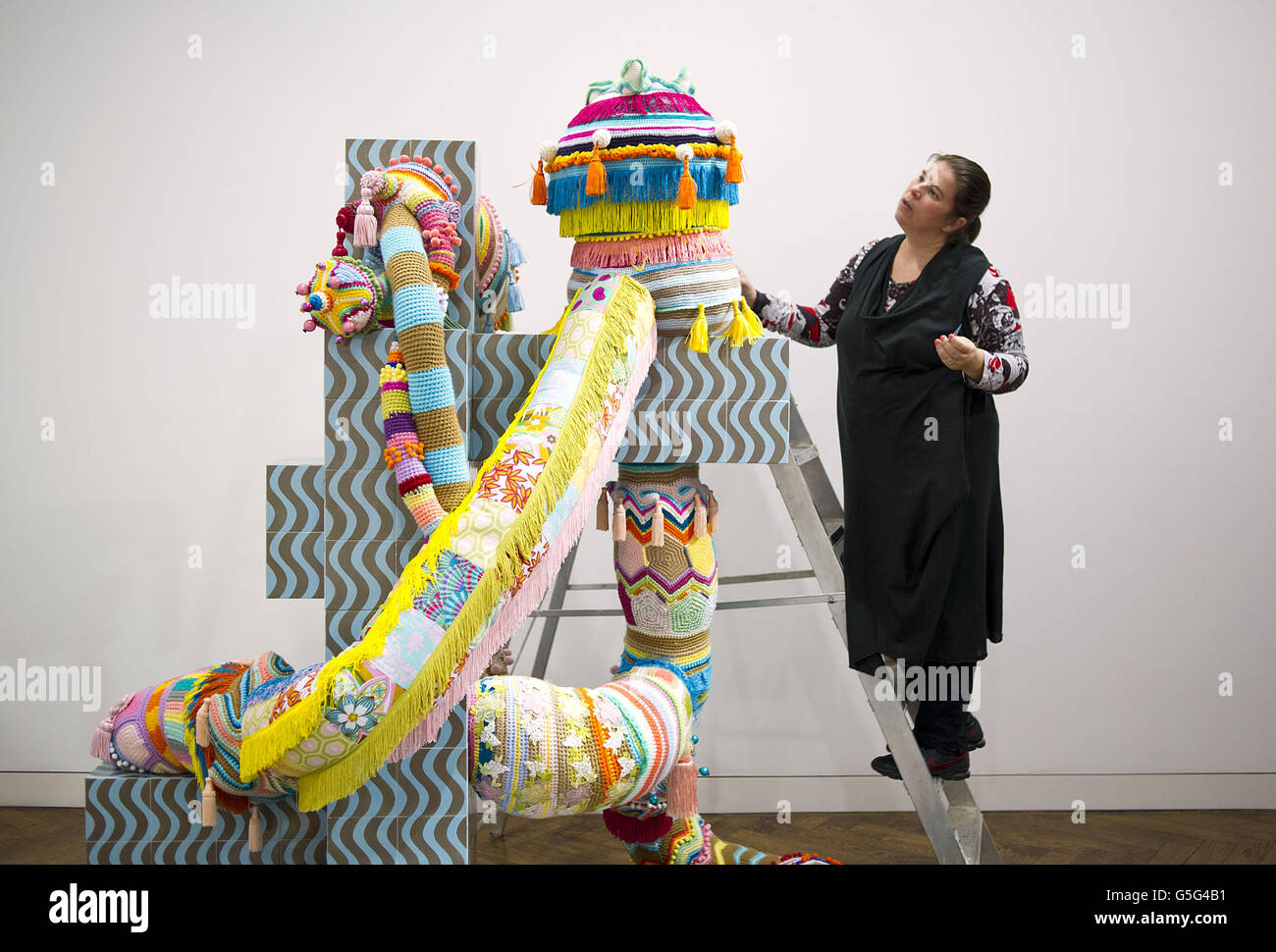 Portuguese artist Joana Vasconcelos puts the finishing touches to her ...