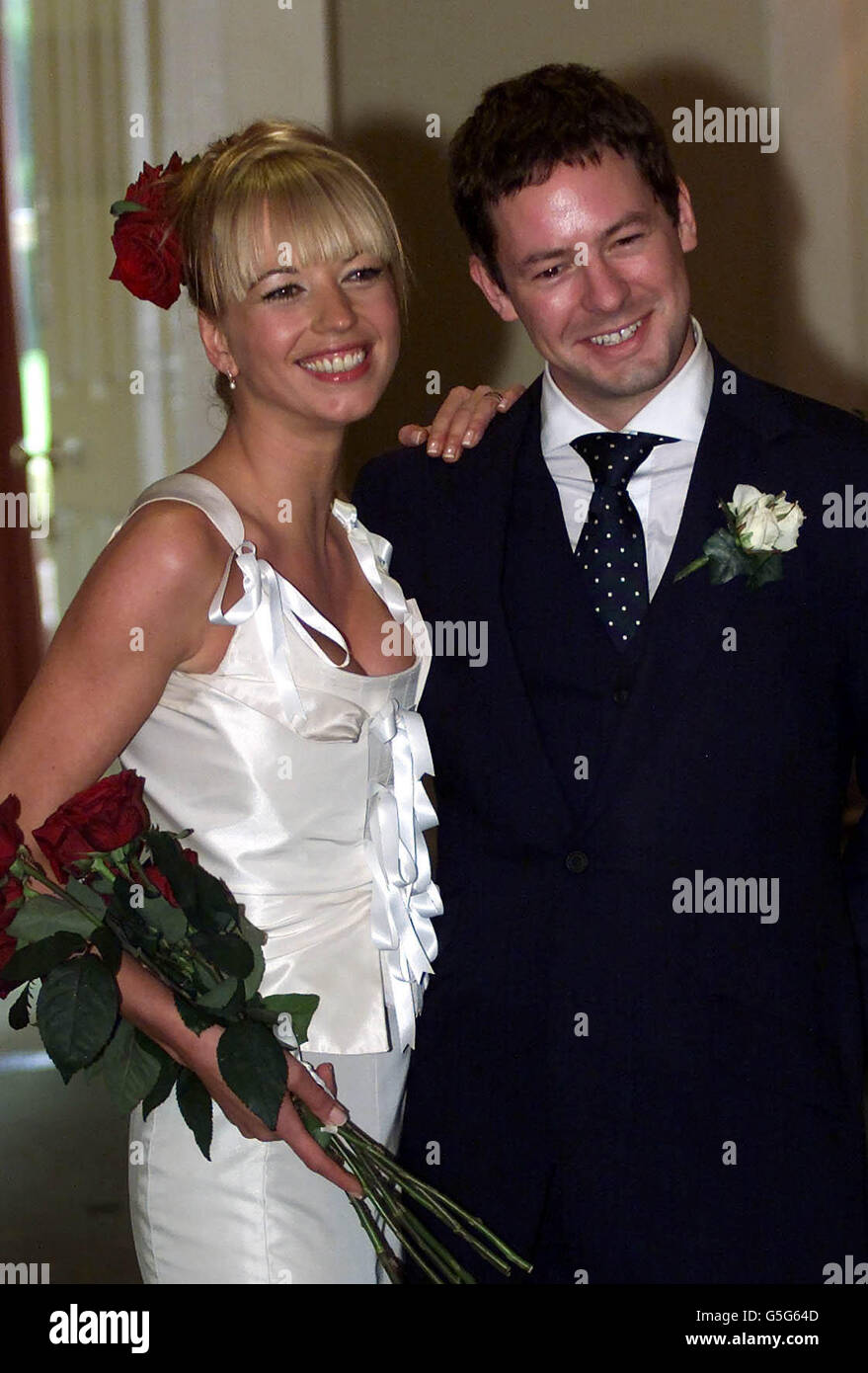 BBC Radio 1 Breakfast Show host Sara Cox went to the rain-whipped hills of Co. Wicklow, Ireland. to have her marriage to DJ sweetheart Jon Carter blessed. The couple walked down the aisle at a ceremony in the tiny village of Macreddin. *- two days after their civil marriage in a London register office. Stock Photo