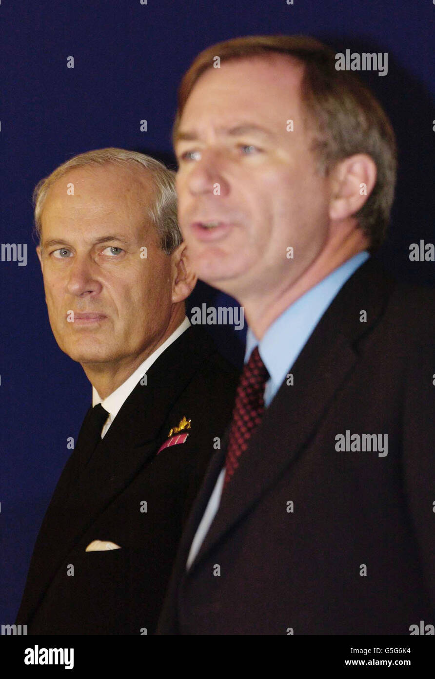 Defence Secretary Geoff Hoon and Chief of Defence Staff, Admiral Sir Michael Boyce (L) speaking during a press conference held at the Military of Defence, central London. * He announced US and British forces struck at 30 targets in Afghanistan last night, all military installations and the Afghan civilian population was not targeted during the war on terrorism. Stock Photo