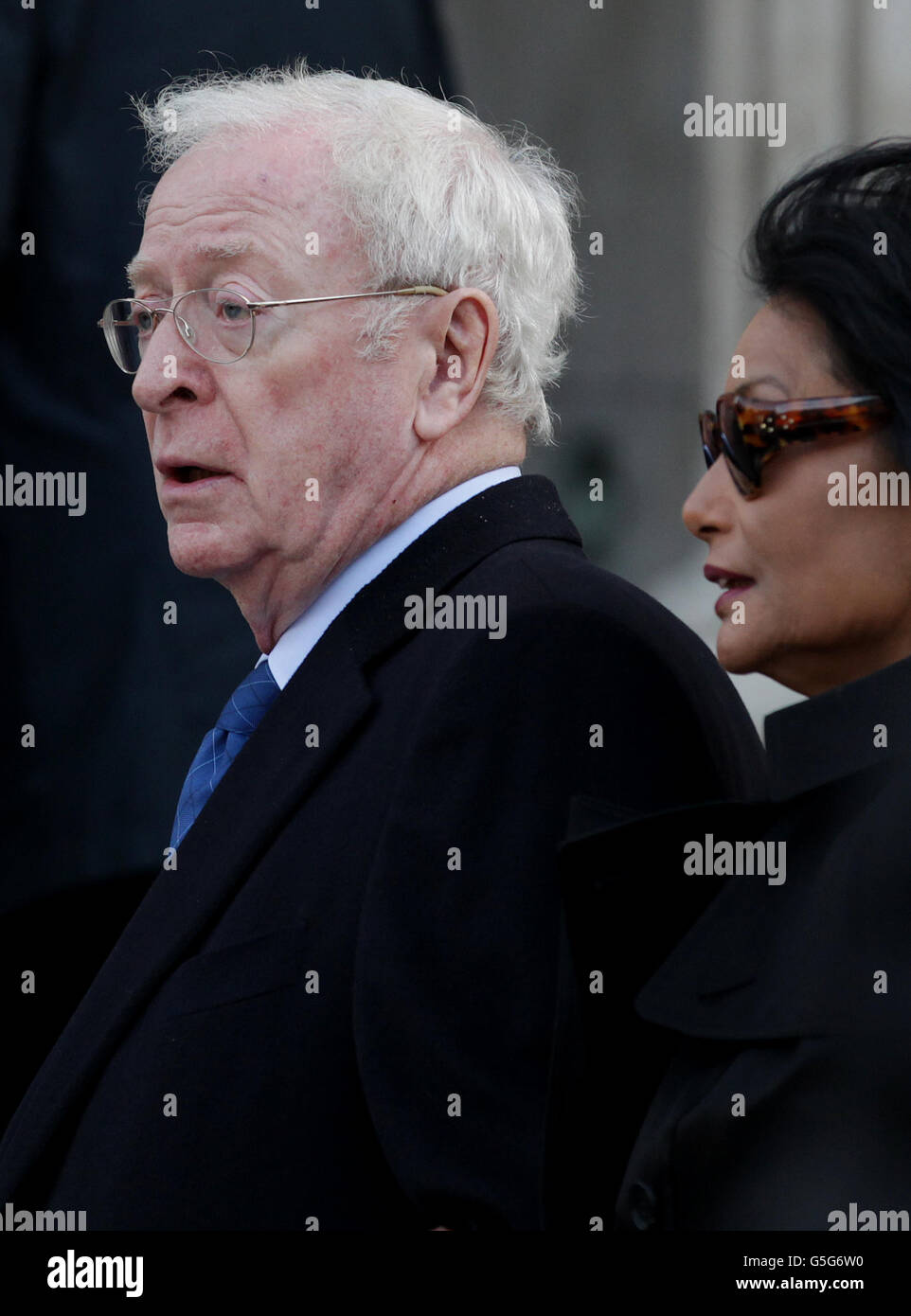 Sir Michael Caine with his wife Shakira arrive at St Paul's Cathedral in London, for the memorial service of hairdresser Vidal Sassoon who died in May. Stock Photo