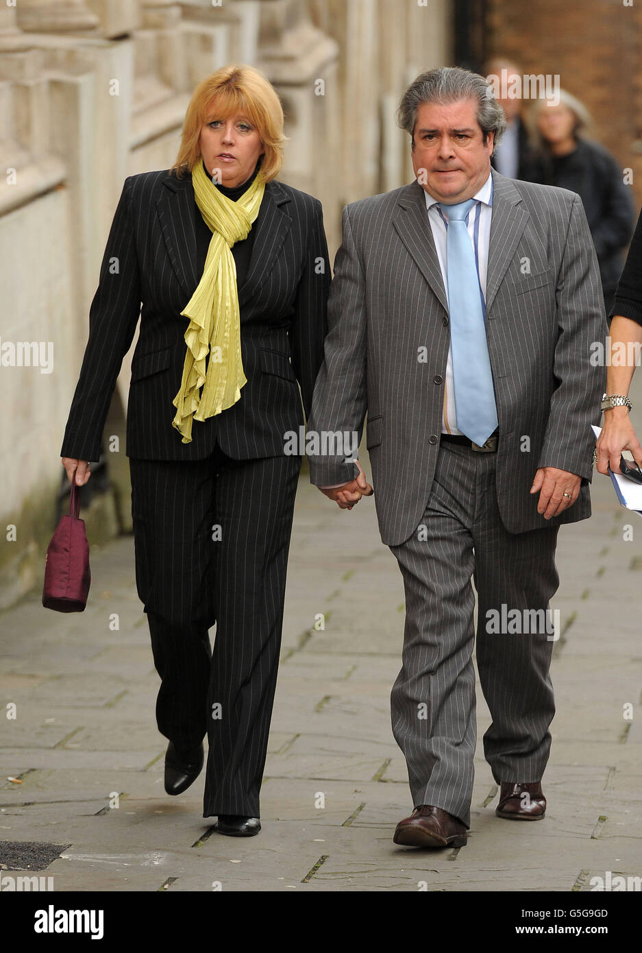 Father of Sian O'Callaghan, Mick O'Callaghan (centre) arrives with his partner Debbie (left) at Bristol Crown Court. Stock Photo