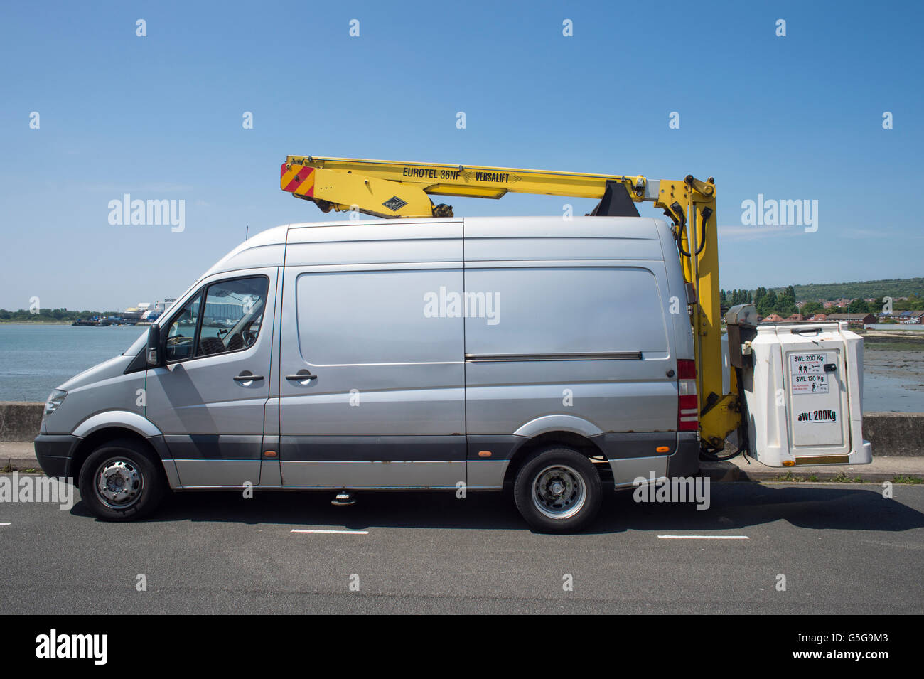Van fitted with a hydraulic 'cherry picker' lift Stock Photo Alamy