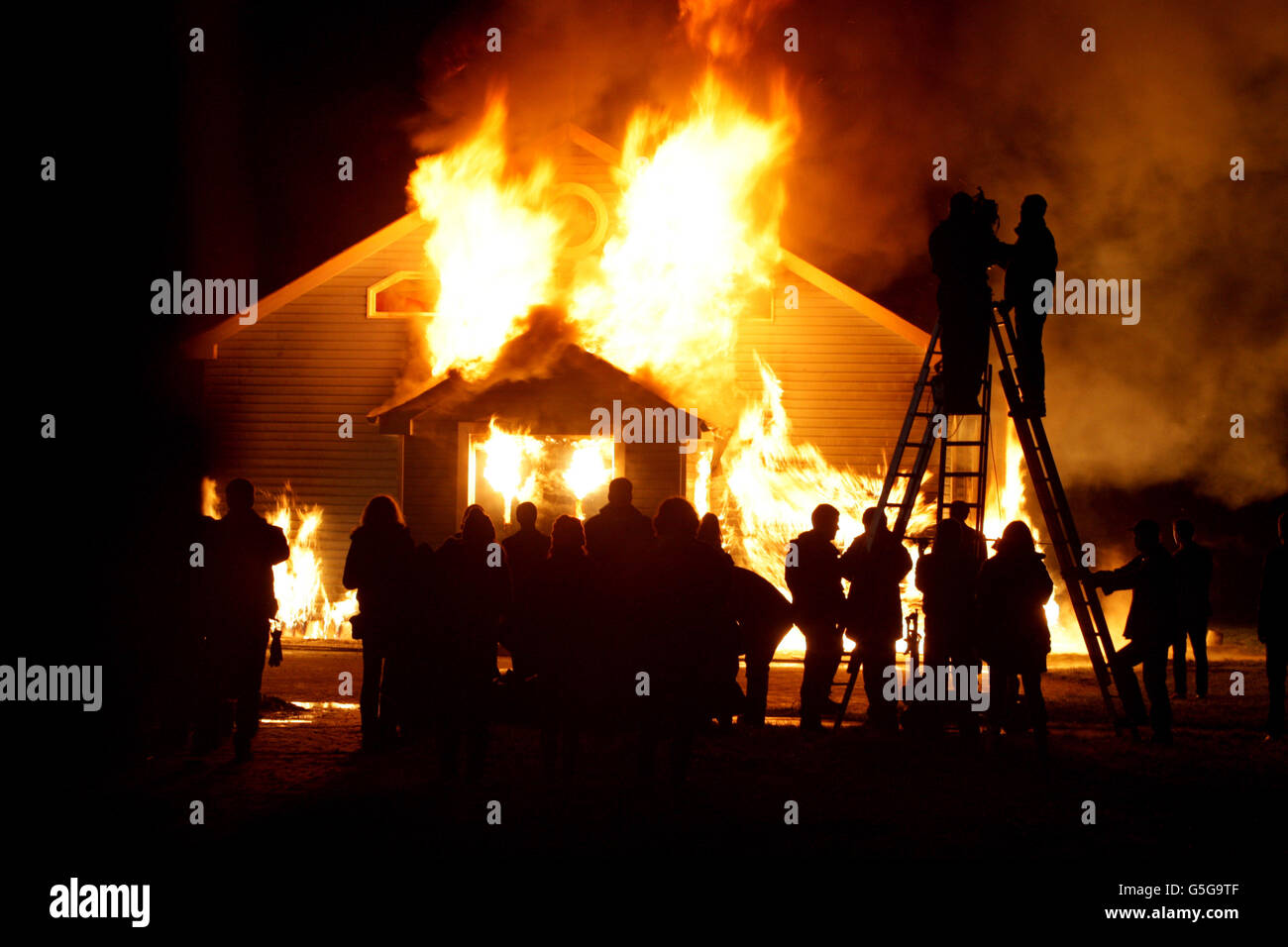Clavary filming - Ireland. A mock church is burnt down on the set of the new Irish movie 'Calvary' in Rush, Co.Dublin. Stock Photo