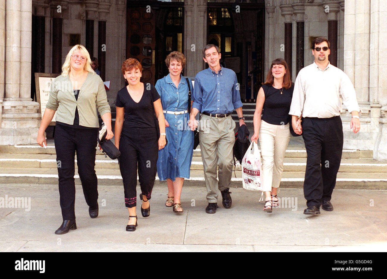 (L-R) Lisa Mifflin, Sharon Lewis, Alison and husband Andrew Pearce and Jane and husband Lee Rimell - some of the parents of the four children caught up in a legal row over a local education authority's admissions policy - were celebrating , at the High Court, London. *...after a court ruled they should be allowed into the same school as their older brothers and sisters. A High Court judge in London rejected a challenge by South Gloucestershire Council to an independent appeals panel's decision in favour of the parents. The council - which may yet seek to take the case to the Court of Appeal Stock Photo