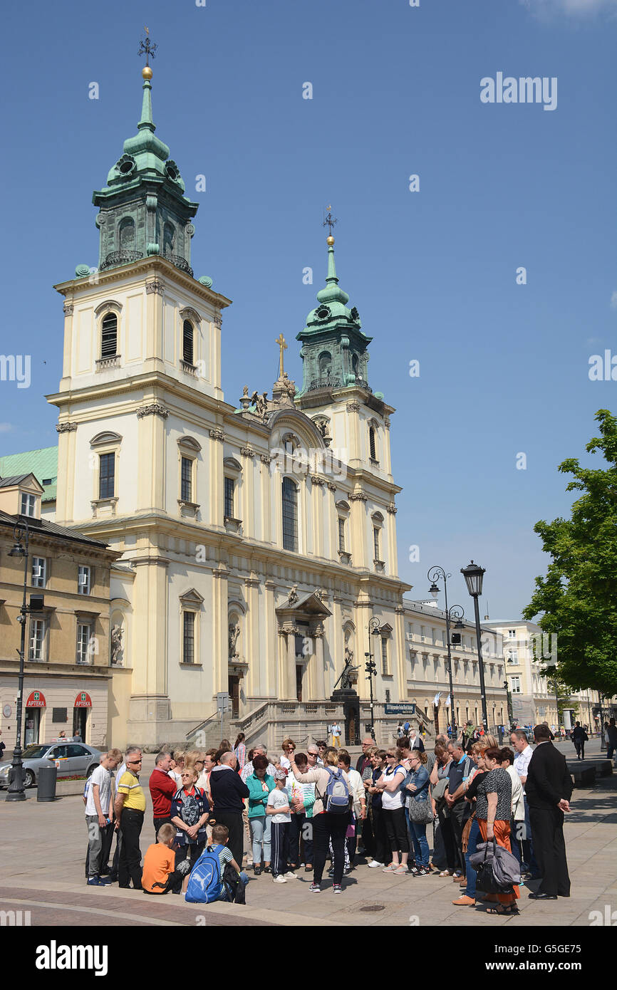 group tourists visiting the town , Ste Croix church, Krakowskie Przedmieście, Warsaw, Poland Stock Photo