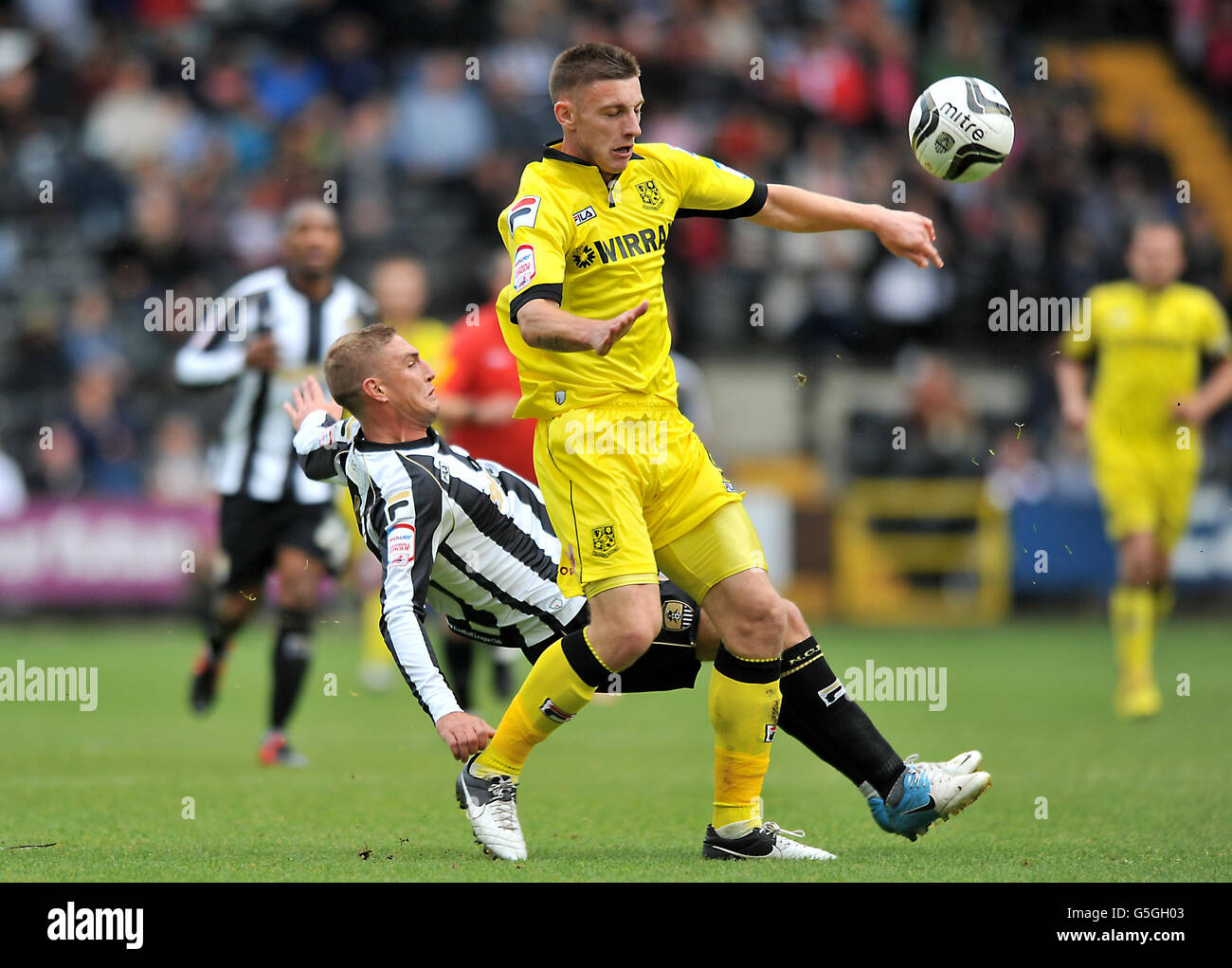 Tranmere Rovers' Jake Cassidy (top) and Notts County's Gary Liddle battle for the ball during the npower Football League One match at Meadow Lane, Nottingham. Stock Photo