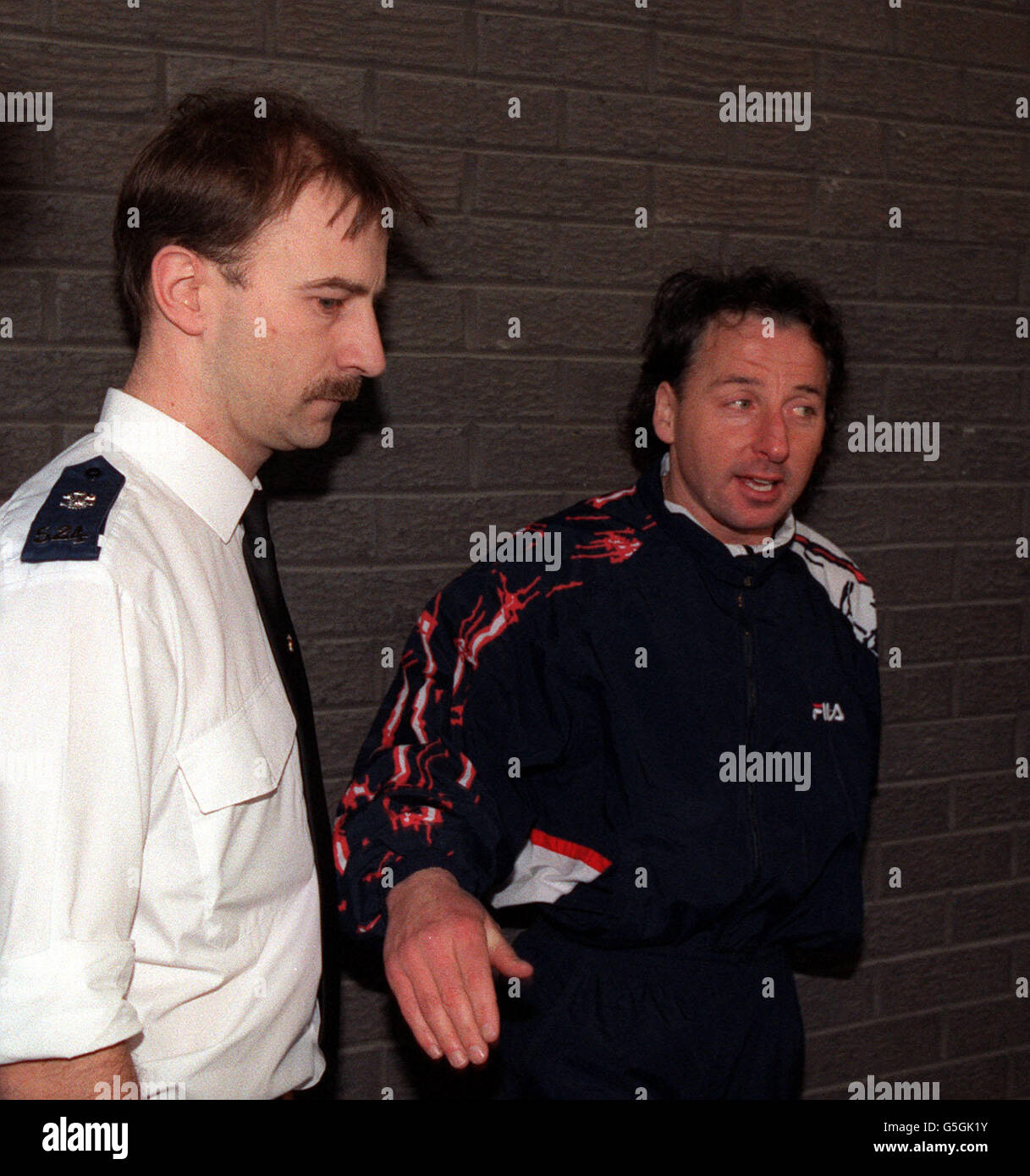 Wrexham and former Manchester United footballer Mickey Thomas pictured outside Wrexham police station after appearing before the magistrates court in connection with charges of passing forged banknotes. Stock Photo