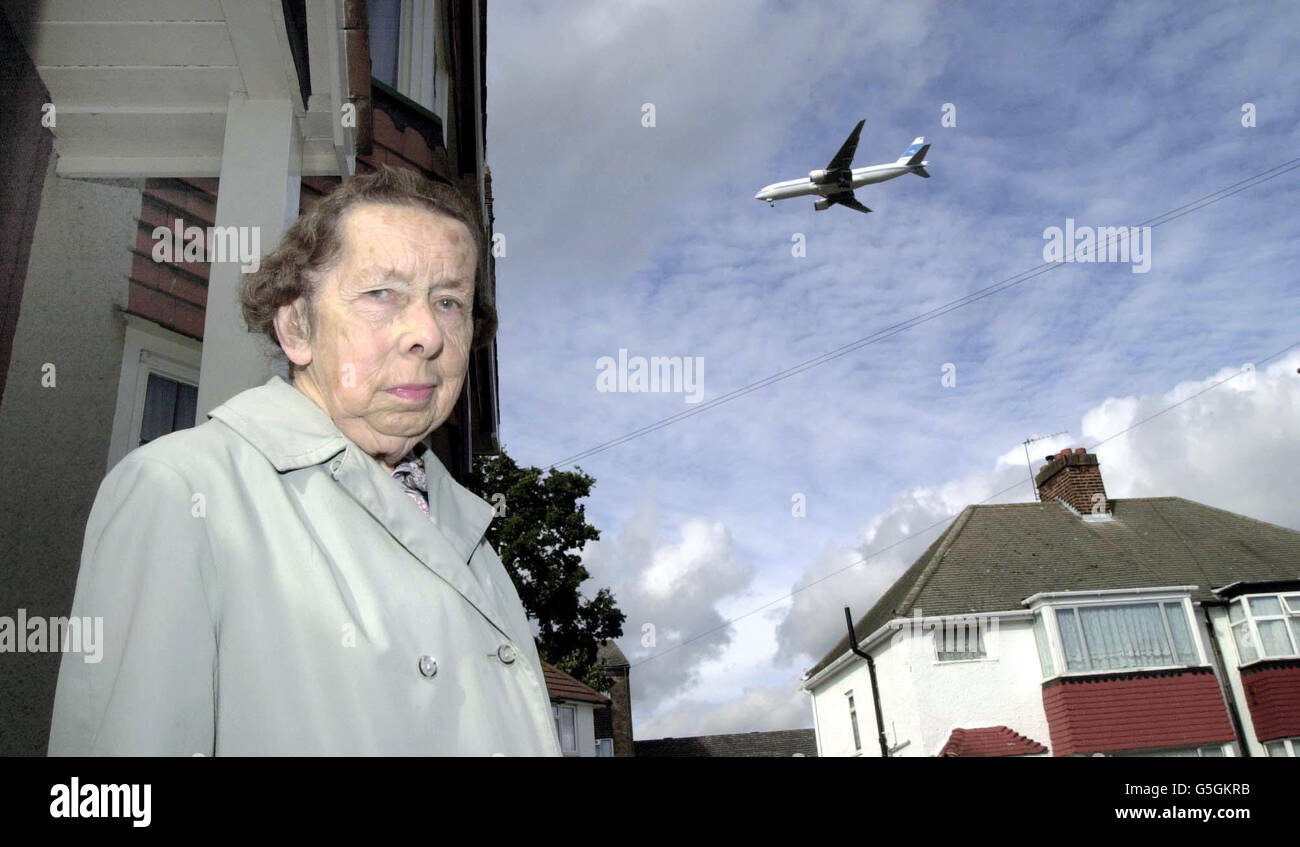 Anti-noise campaigner Miss Nina Bevan outside her home in Hounslow, with a plane on the Heathrow airport flightpath. Campaigners were celebrating a key victory in the European Court of Human Rights which could see overnight flights at UK airports being scrapped. * The court case was brought against the Department of Transport by eight residents living under the flight path in west London. The European Court of Human Rights said that the night flights violated the residents' basic human rights. The ruling is not binding on the UK Government but Britain has generally gone along with judgments Stock Photo
