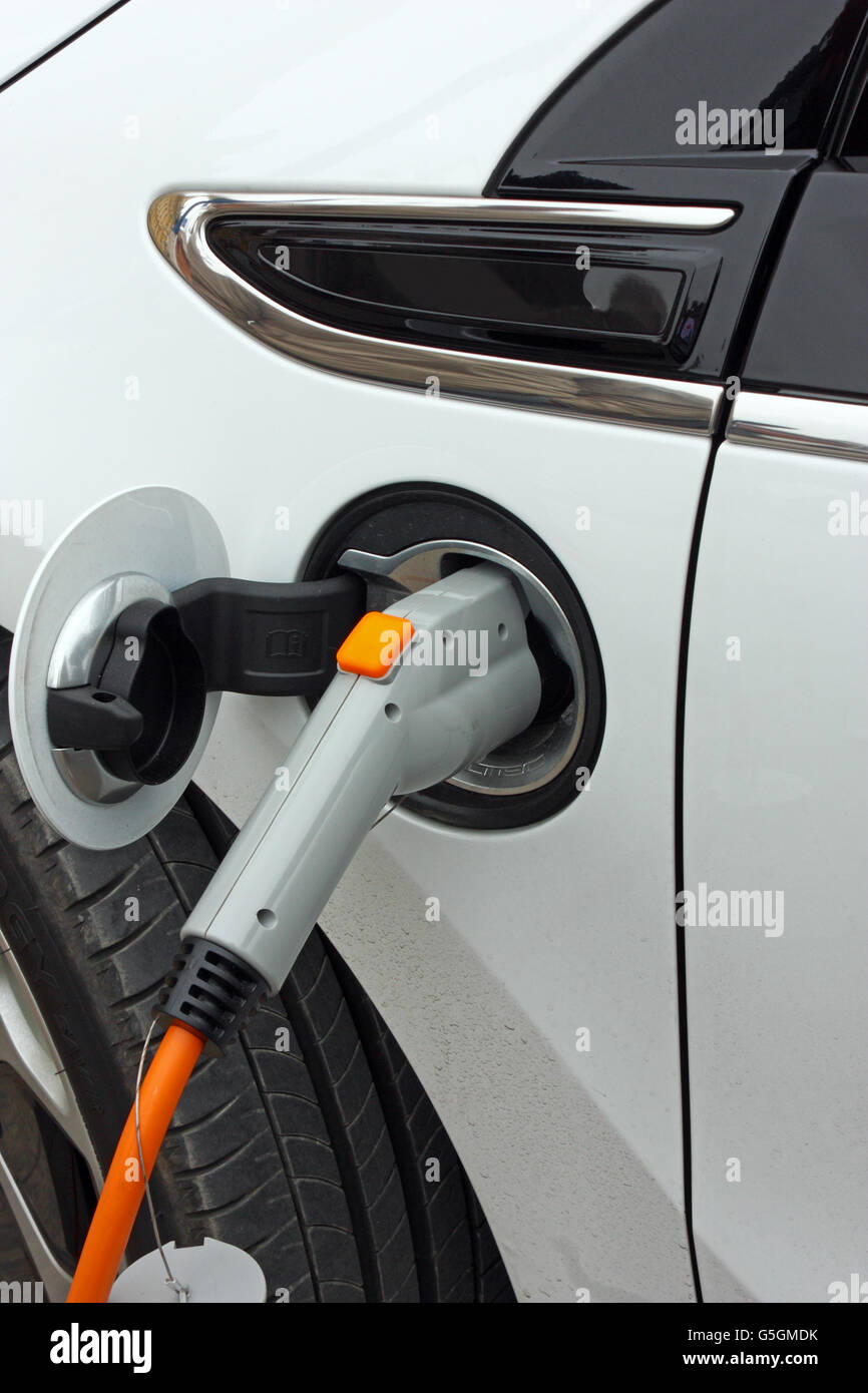 Electric car charging detail. Green and renewable energy technology ...