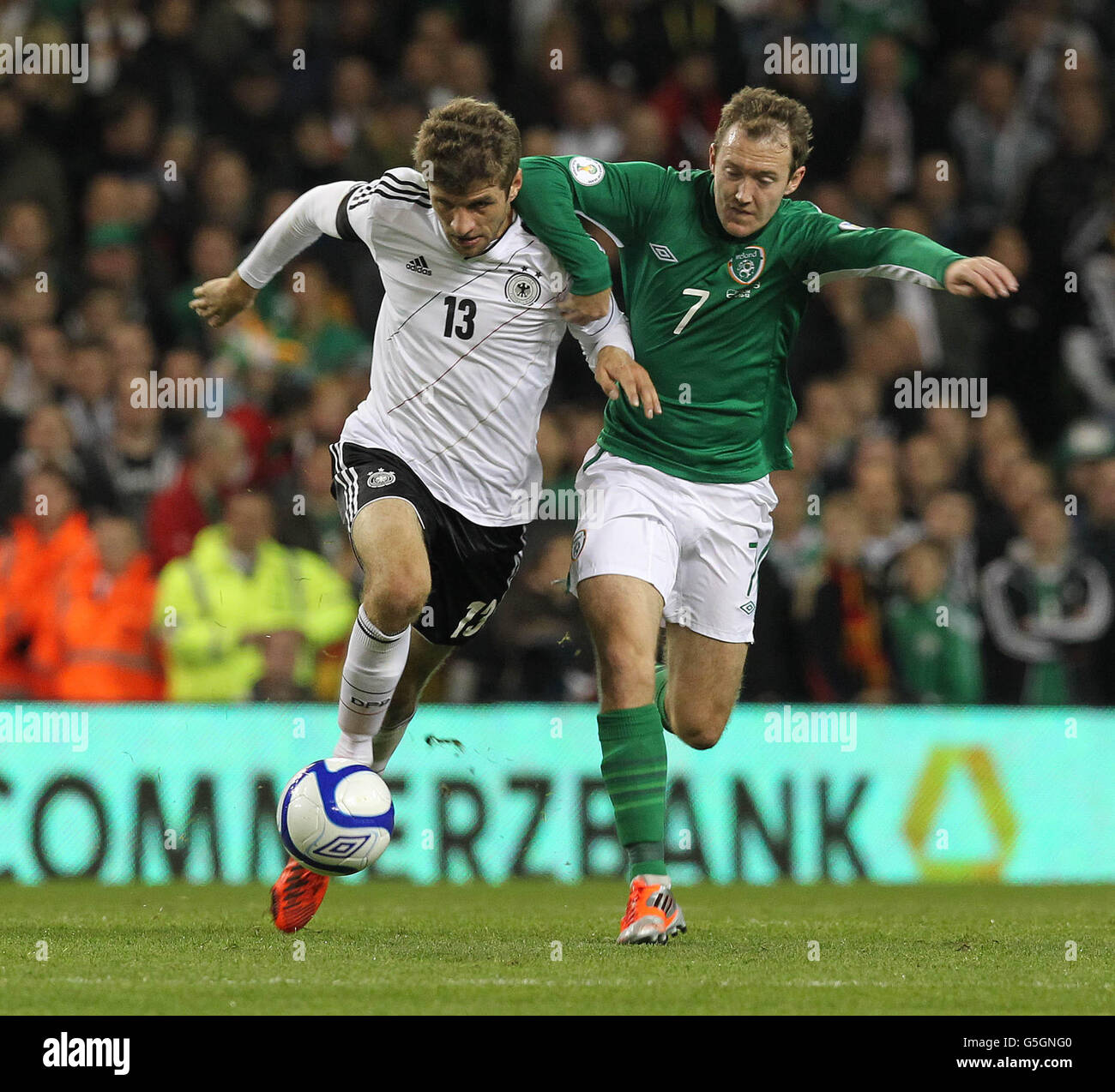 Republic of Ireland'sAiden McGeady (right) and Germanys Thomas Muller battle for the ball during the 2014 FIFA World Cup Qualifying match at the Aviva Stadium, Dublin, Ireland. Stock Photo