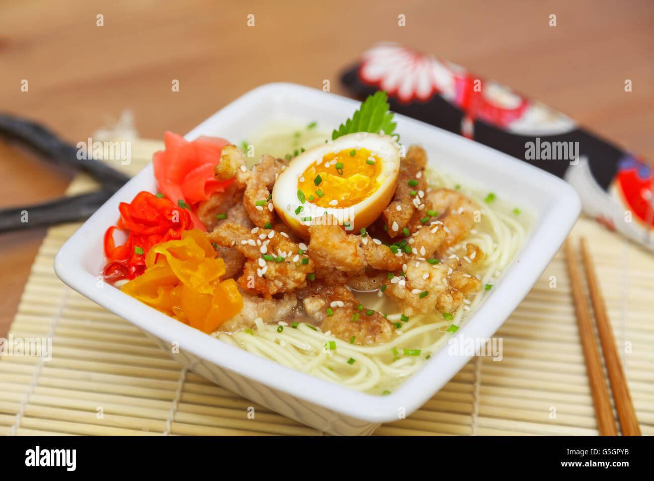 Chicken ramen topped with roast chicken, egg and pickles Stock Photo