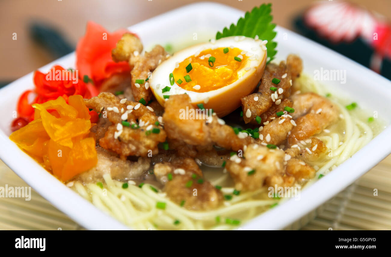 Chicken ramen topped with roast chicken, egg and pickles Stock Photo