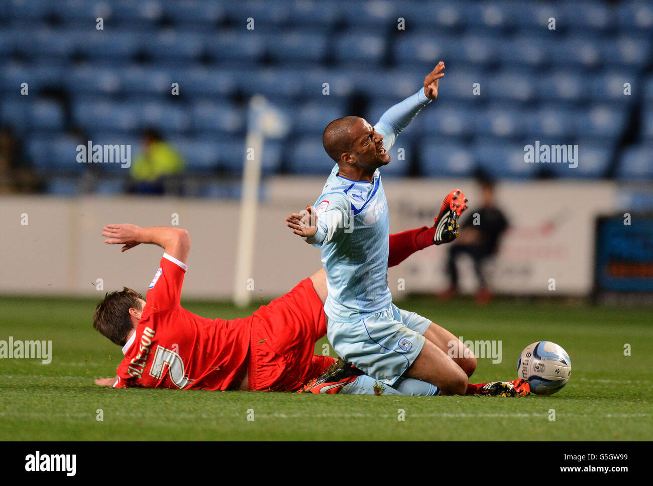 Coventry City's David McGoldrick tackled by Milton Keynes Dons' Stephen Gleeson Stock Photo