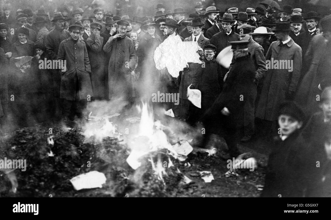 Burning pamphlets in the streets of Berlin, captured from newspaper offices. ** Note defect from scan ** Stock Photo