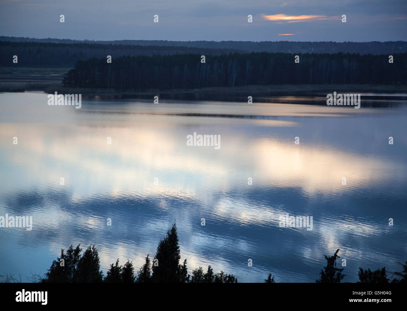 Cloud reflections off Nemunas River after the sunset (Lithuania). Stock Photo