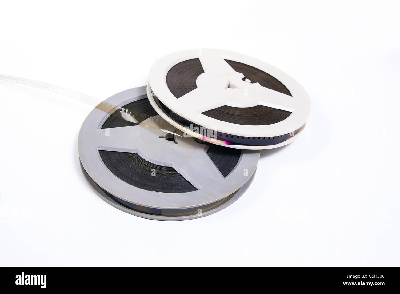 A reel of motion picture film on a white background. Old film strip
