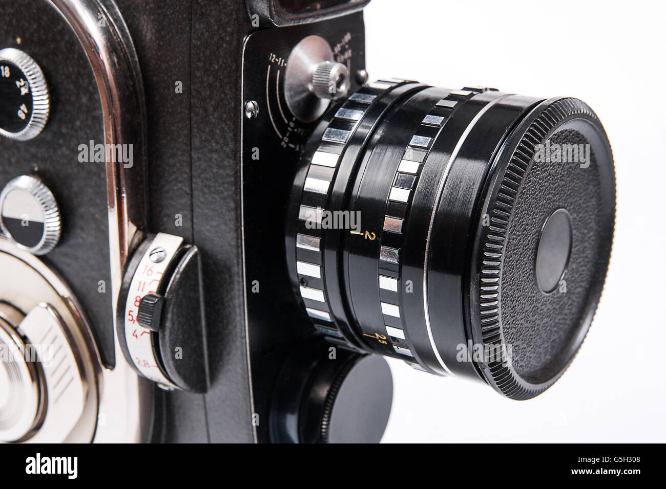 Old movie camera with lens isolated on a white background. Close up
