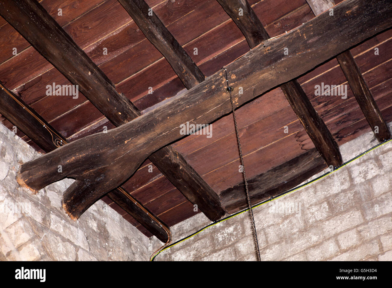 UK, England Northumberland, Bamburgh, parish church, forked beam supporting tower floor upon which St Aidan died Stock Photo