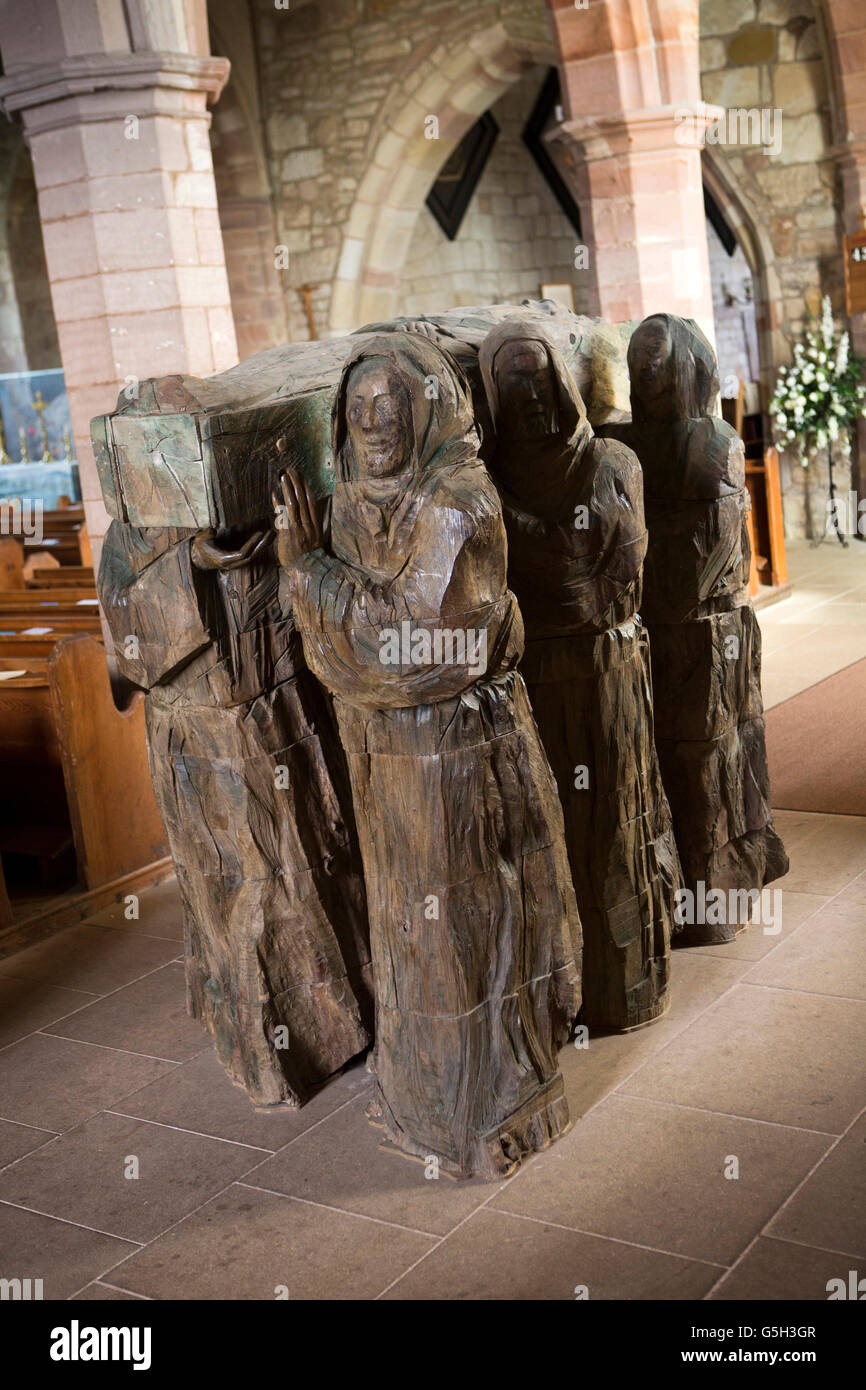 UK, England Northumberland, Holy Island,, St Mary’s Church The Journey, elm wood carving of St Cuthbert’s coffin procession Stock Photo