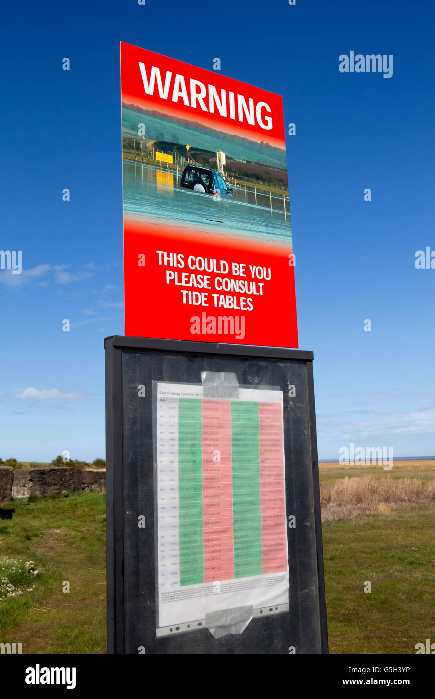 UK, England Northumberland, Lindisfarne, Holy Island, causeway crossing times warning sign Stock Photo