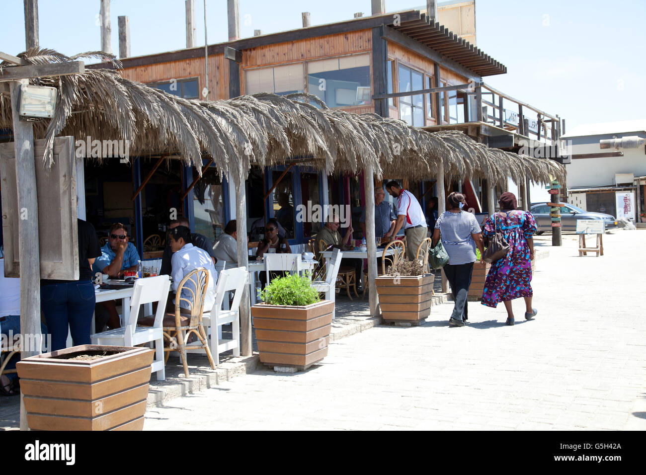 Anchors Restaurant with Diners on Walvis Bay waterfront in Namibia