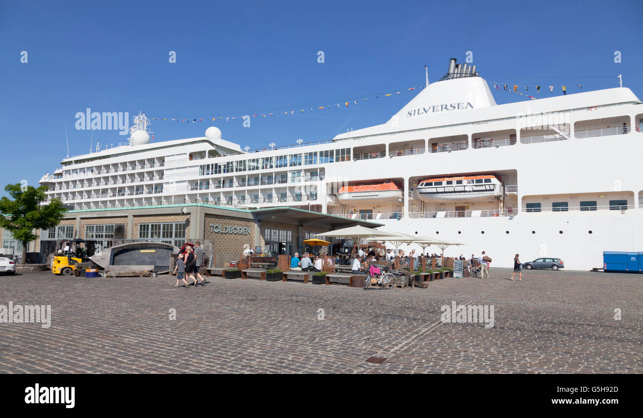 Summer life at the Toldboden restaurant and on the dockside beside the MS Silver Whisper starting a 7 night Baltic cruise. Stock Photo