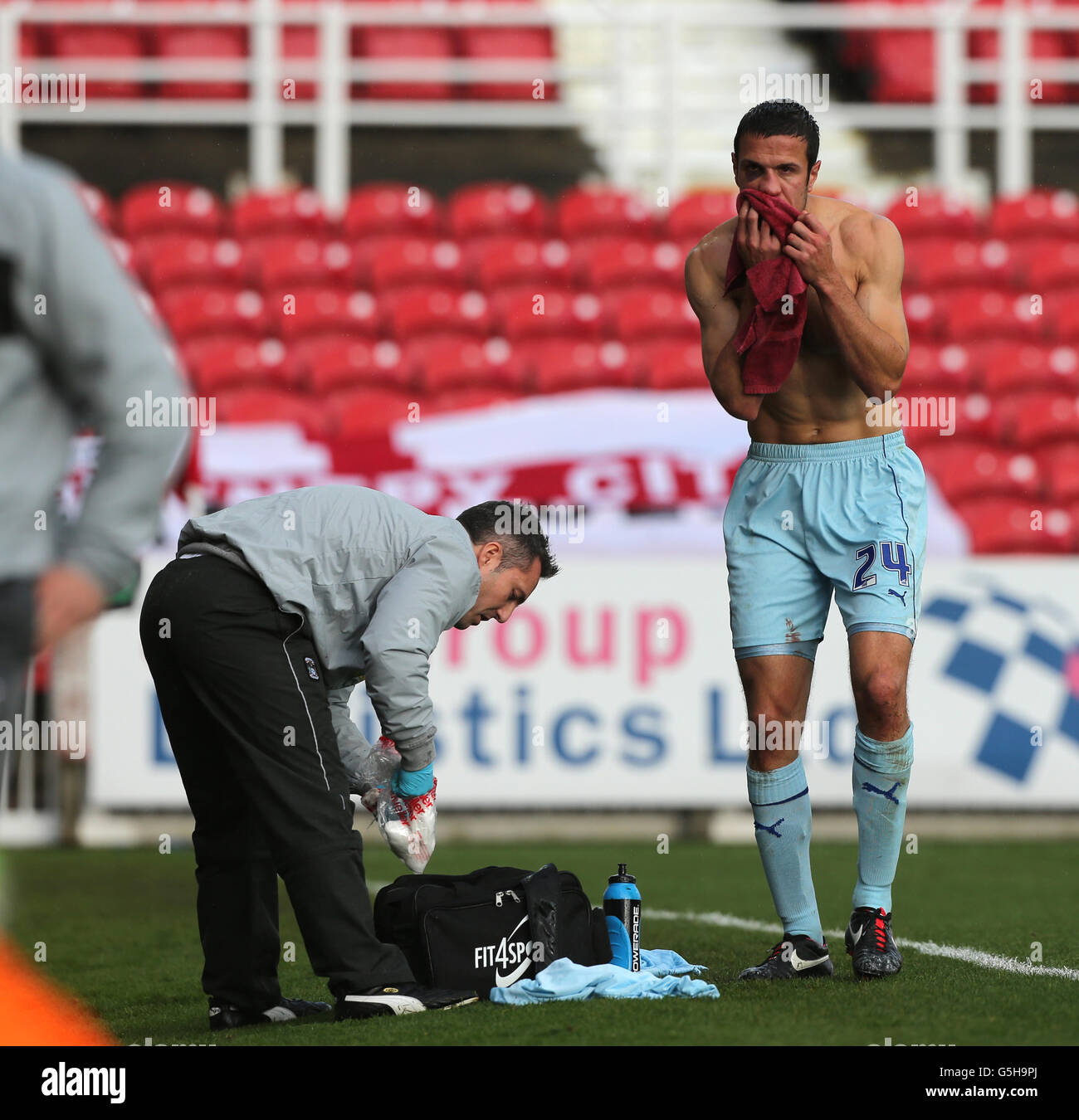 Soccer - nPower League 1 Swindon Town vs Coventry City at County Ground, Swindon. Coventry City's Richard Wood has nose bleed looked at by phyiso Stock Photo