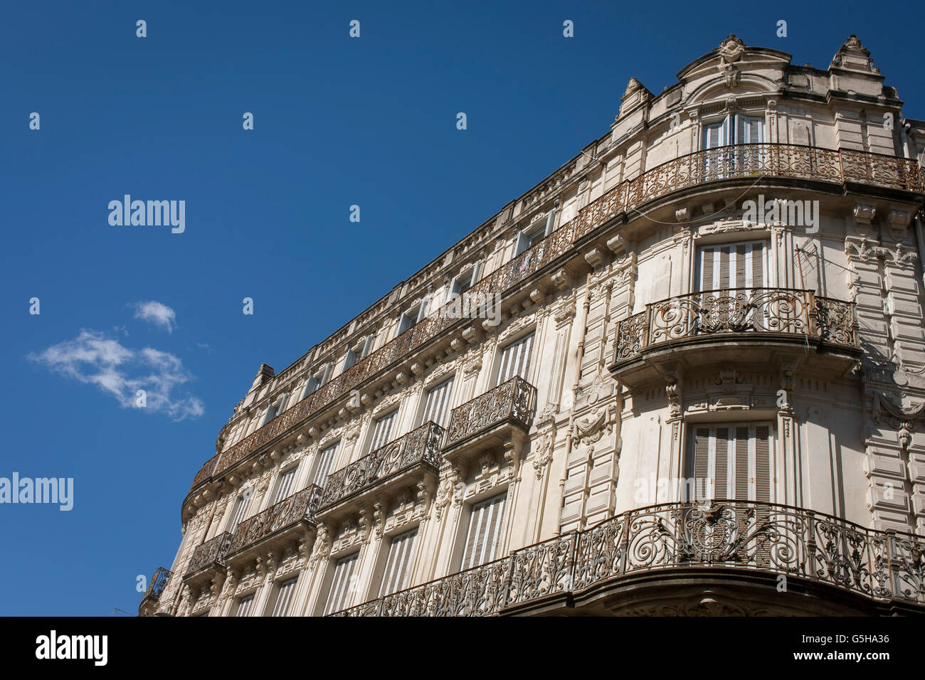 Architecture of apartments with ornate iron railings on Rue Foch in