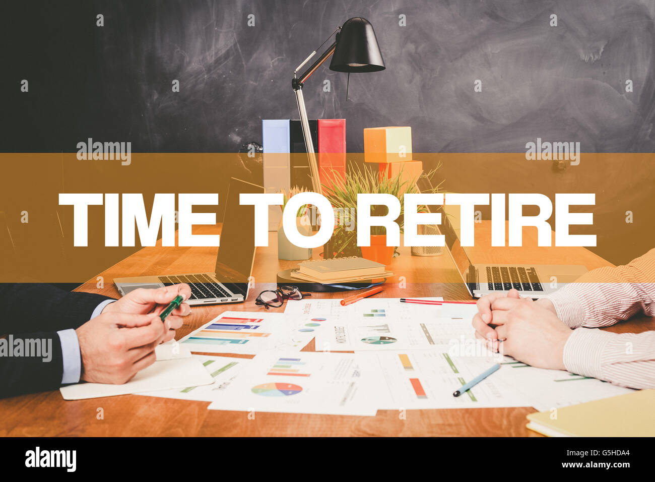 Two Businessman Time To Retire working in an office Stock Photo
