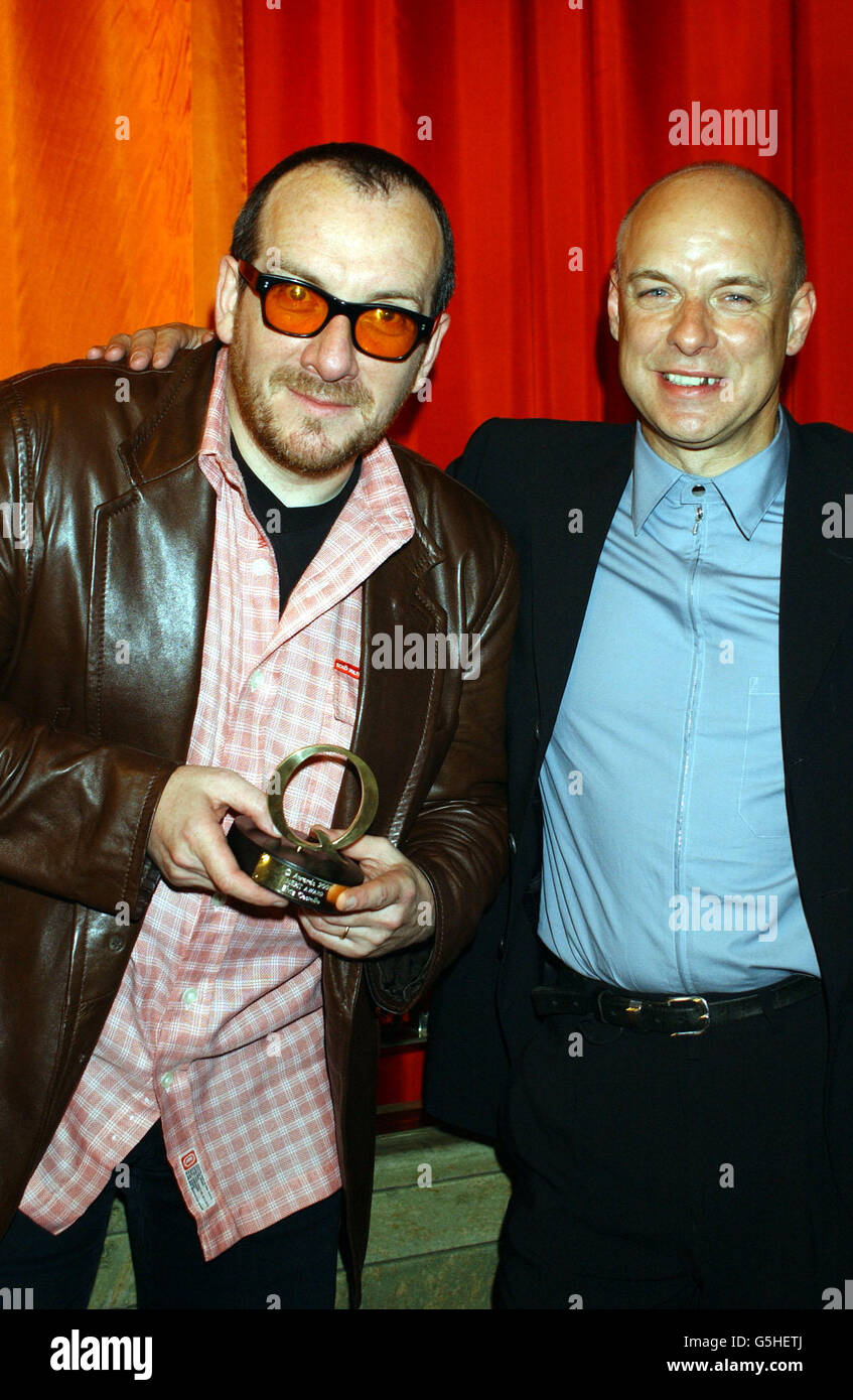 Elvis Costello and Brian Eno during The Q Awards 2001 at the Park Lane Hotel in London. Stock Photo