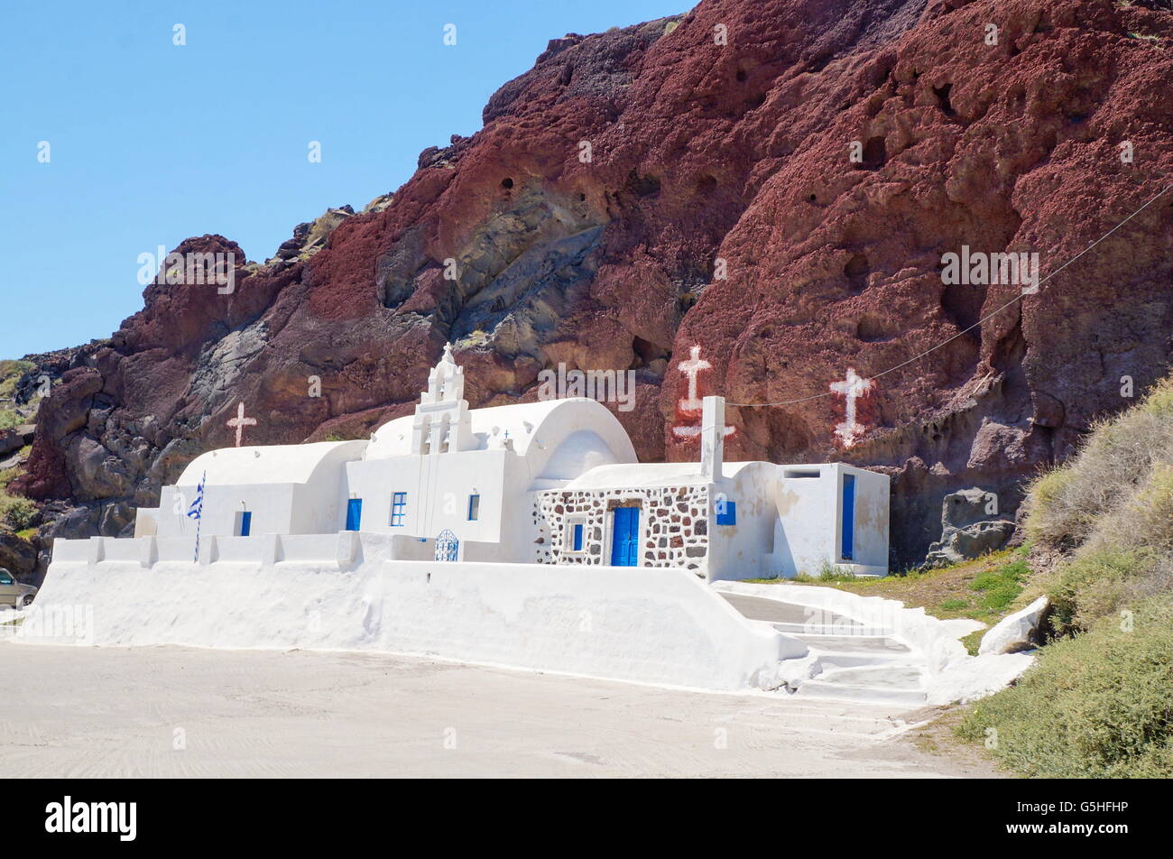 Church at Santorini island in Greece, built in recognizable manner. Red Beach rocks Stock Photo