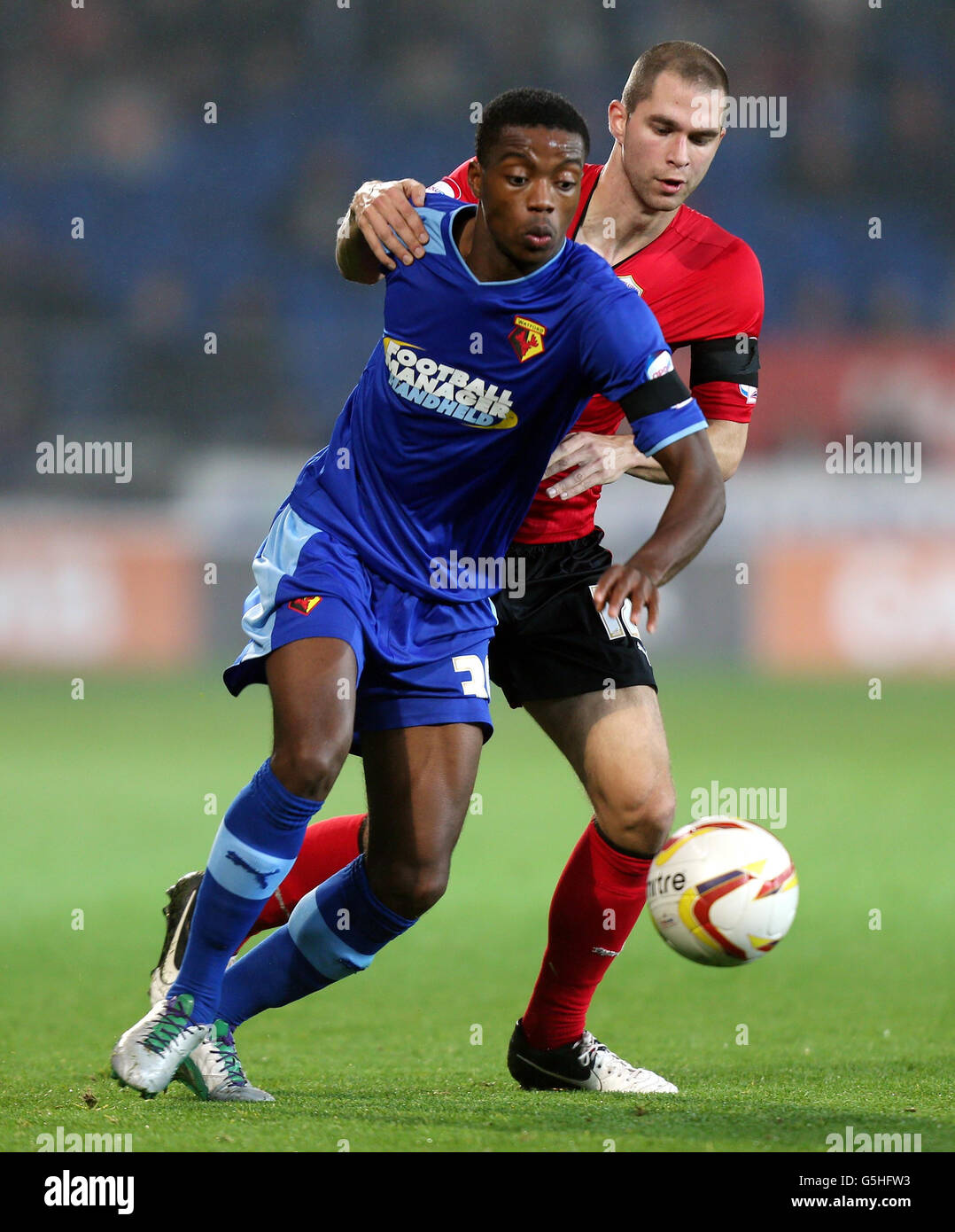 Watford's Nathaniel Chalobah is challenged by Cardiff's Matthew ...