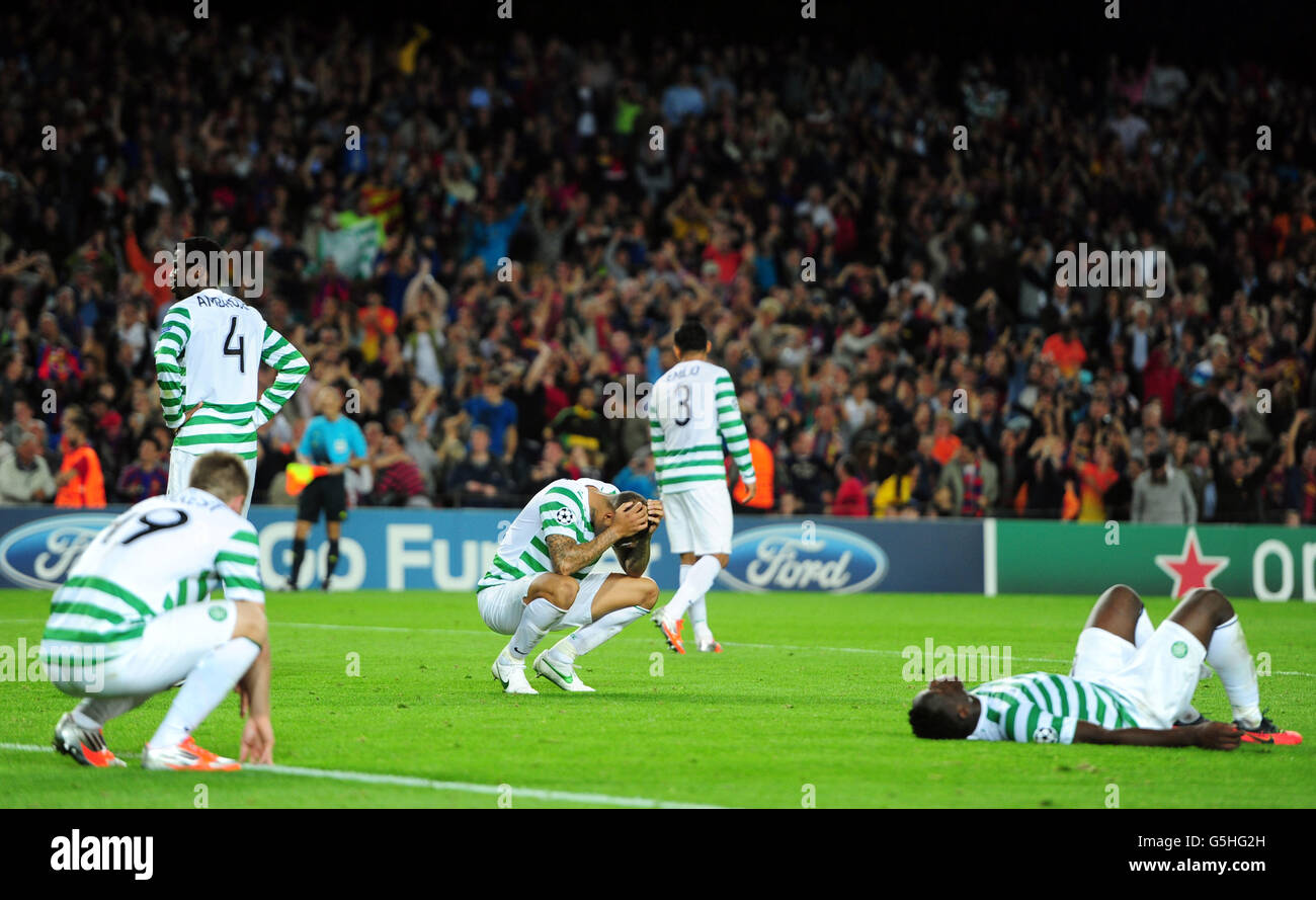 (L-R) Celtic's James Forrest, Efe Ambrose, Kelvin Wilson, Emilio Izaguirre (no3) and Victor Wanyama are dejected after Barcelona score the winning goal in injury time Stock Photo