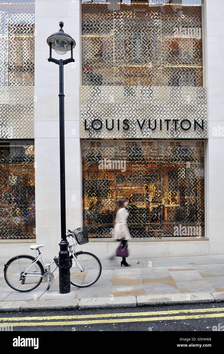 Dinosaur themed window display at Louis Vuitton`s flagship store in New  Bond Street,London Stock Photo - Alamy