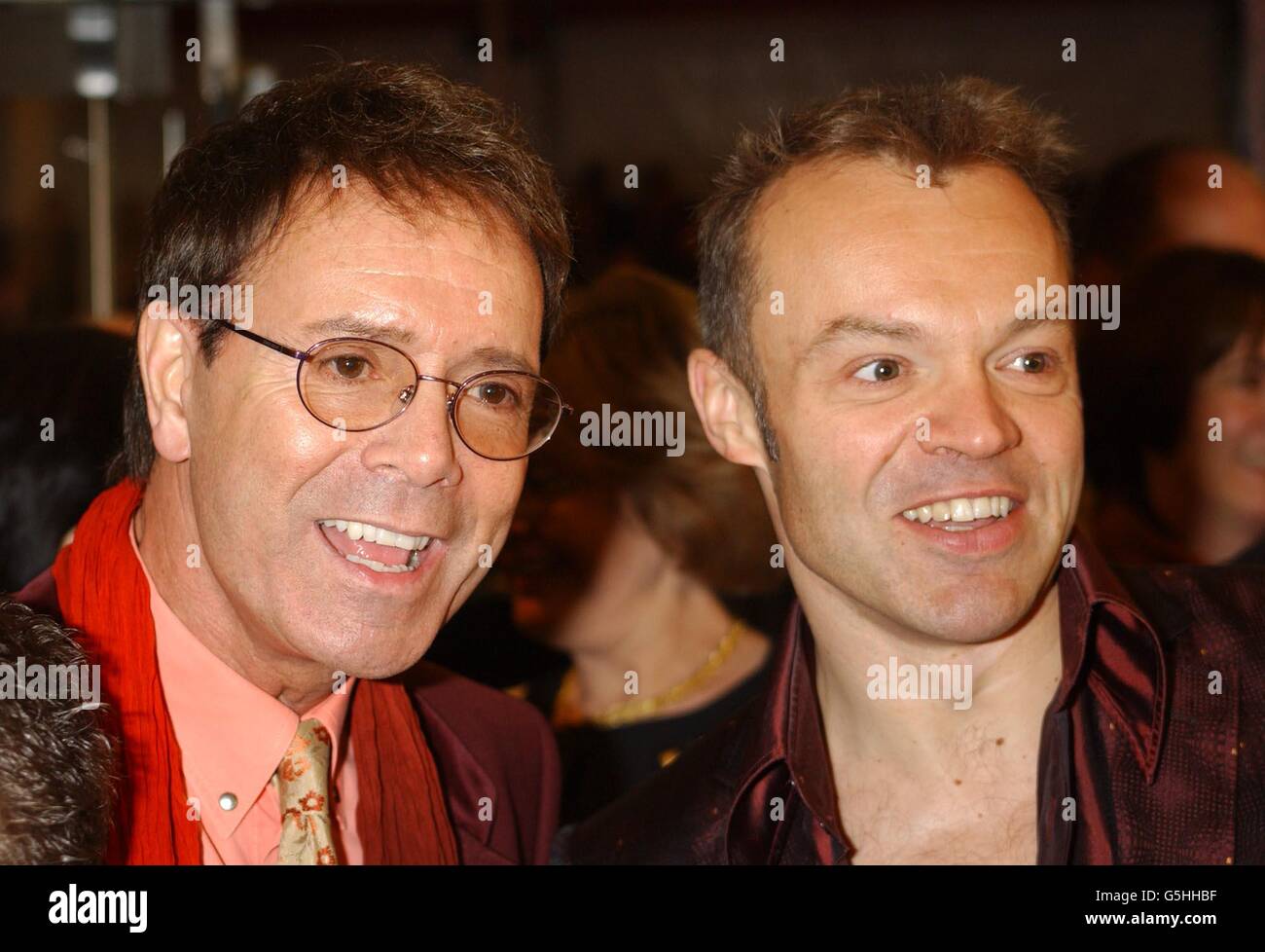Singer Sir Cliff Richard (left) and TV presenter Graham Norton arrive for world premiere of 'Harry Potter and the Philosopher's Stone at the Odeon Leicester Square in London. Stock Photo