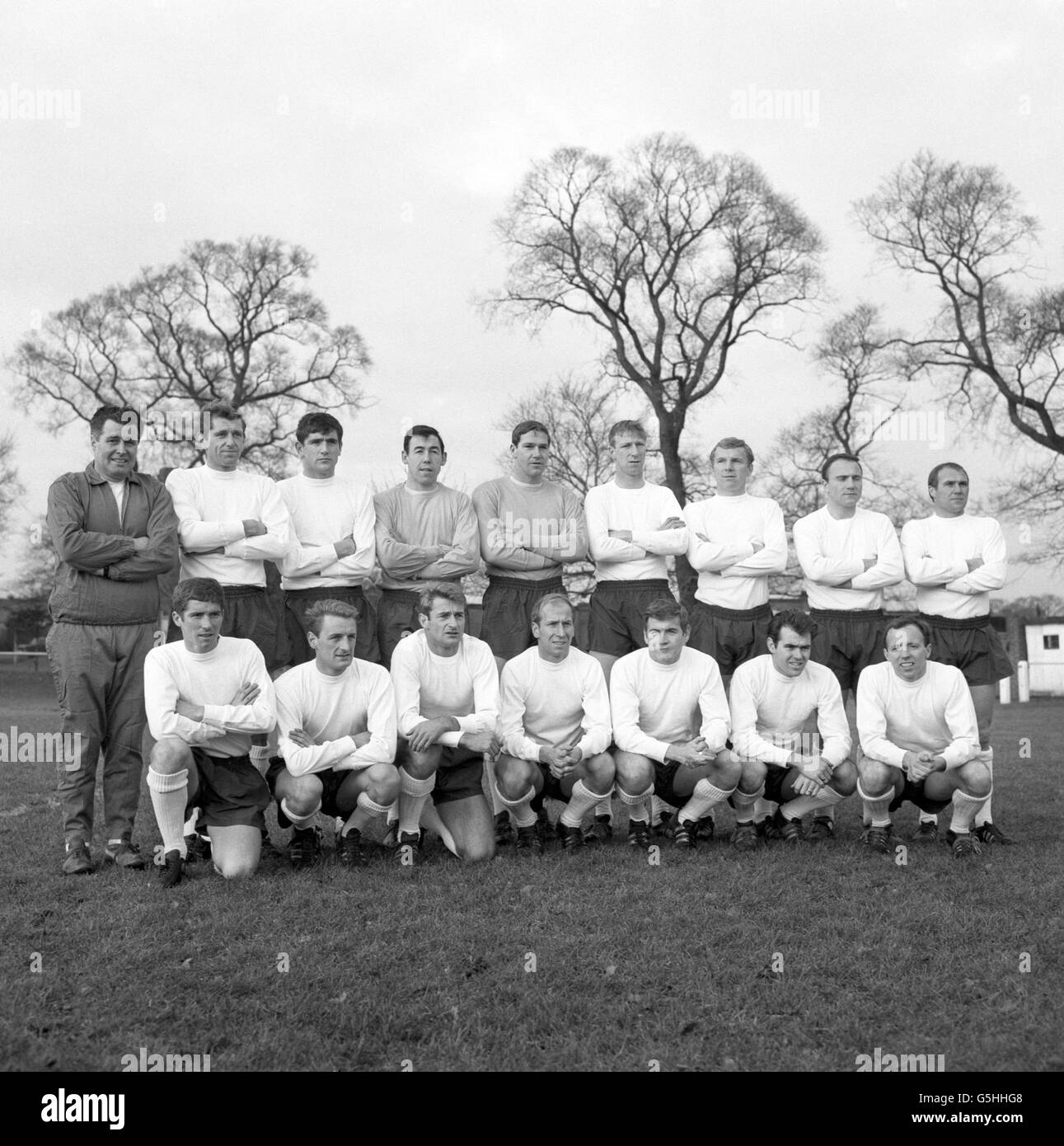 The England squad pictured after training for a match against Spain in Madrid. Back row (l-r): Harold Shepherdson, Keith Newton, Norman Hunter, Gordon Banks, Tony Waiters, Jack Charlton, Bobby Moore, George Cohen and Ray Wilson. Front row (l-r): Alan Ball, George Eastham, Roger Hunt, Bobby Charlton, Joe Baker, John Connelly and Nobby Stiles. Stock Photo