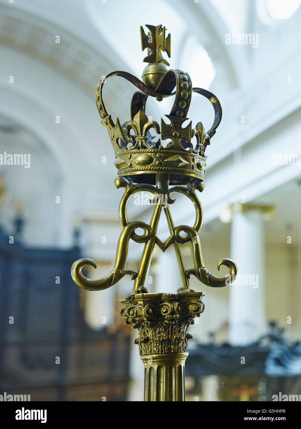 St Magnus the Martyr church in the City of London. Candlesticks with crown and AR, Queen Anne's cypher. Stock Photo