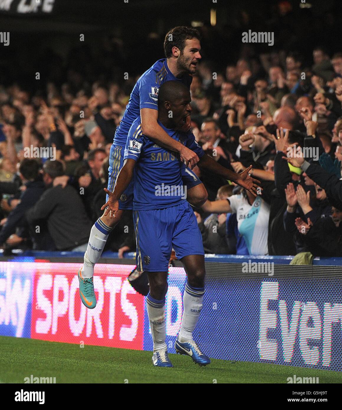 Chelsea's Nascimento Ramires celebrates scoring his side's second goal of the game with teammate Juan Mata (top) Stock Photo