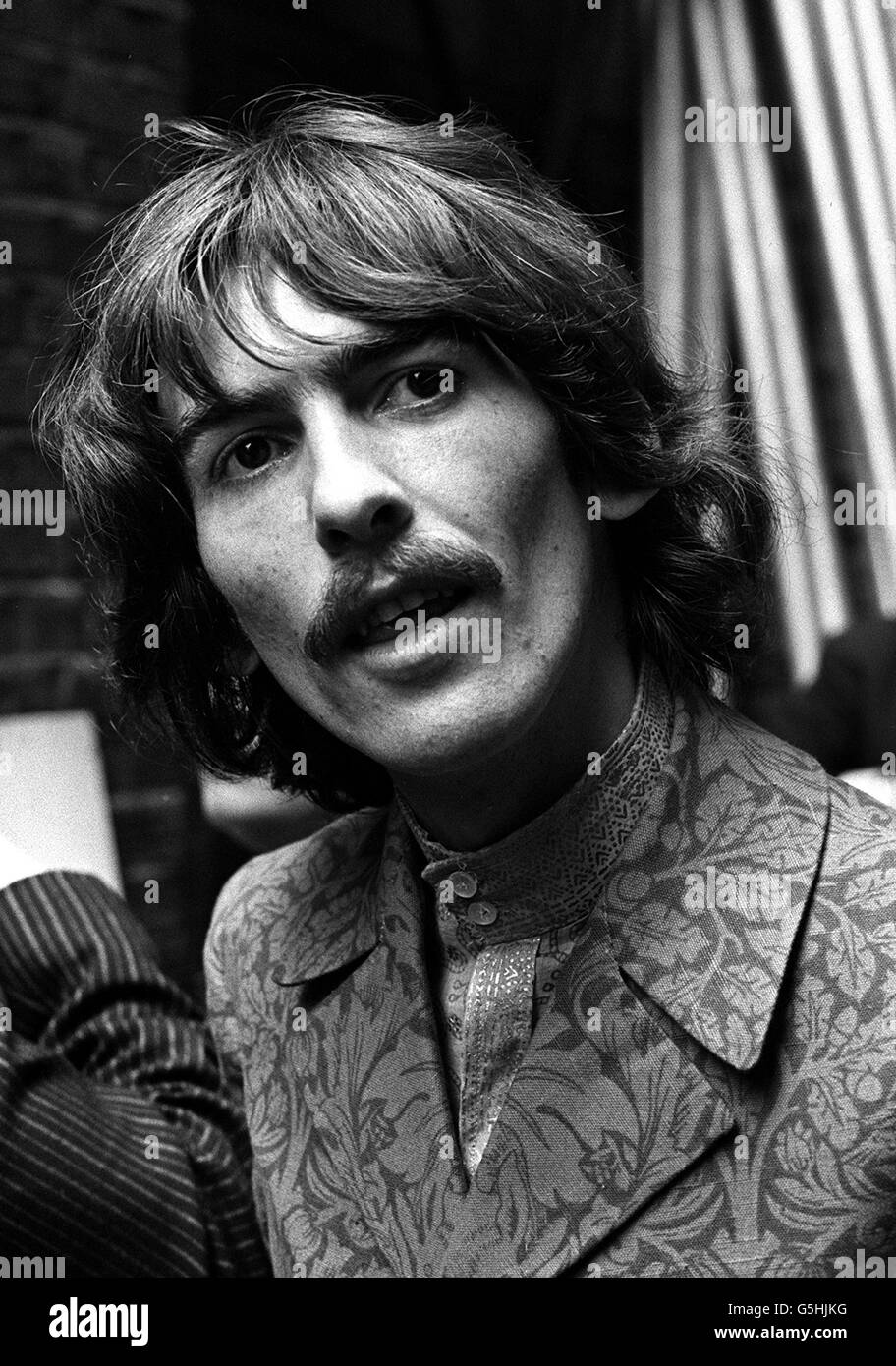 George Harrison, of the Beatles, at the EMI Studios, St. John's Wood, London. He has been rehearsing at the EMI Studios in St. John's Wood, London, for the group's appearance in the international television programme 'Our World'. They have written a song 'All You Need is Love' especially for the programme. Stock Photo