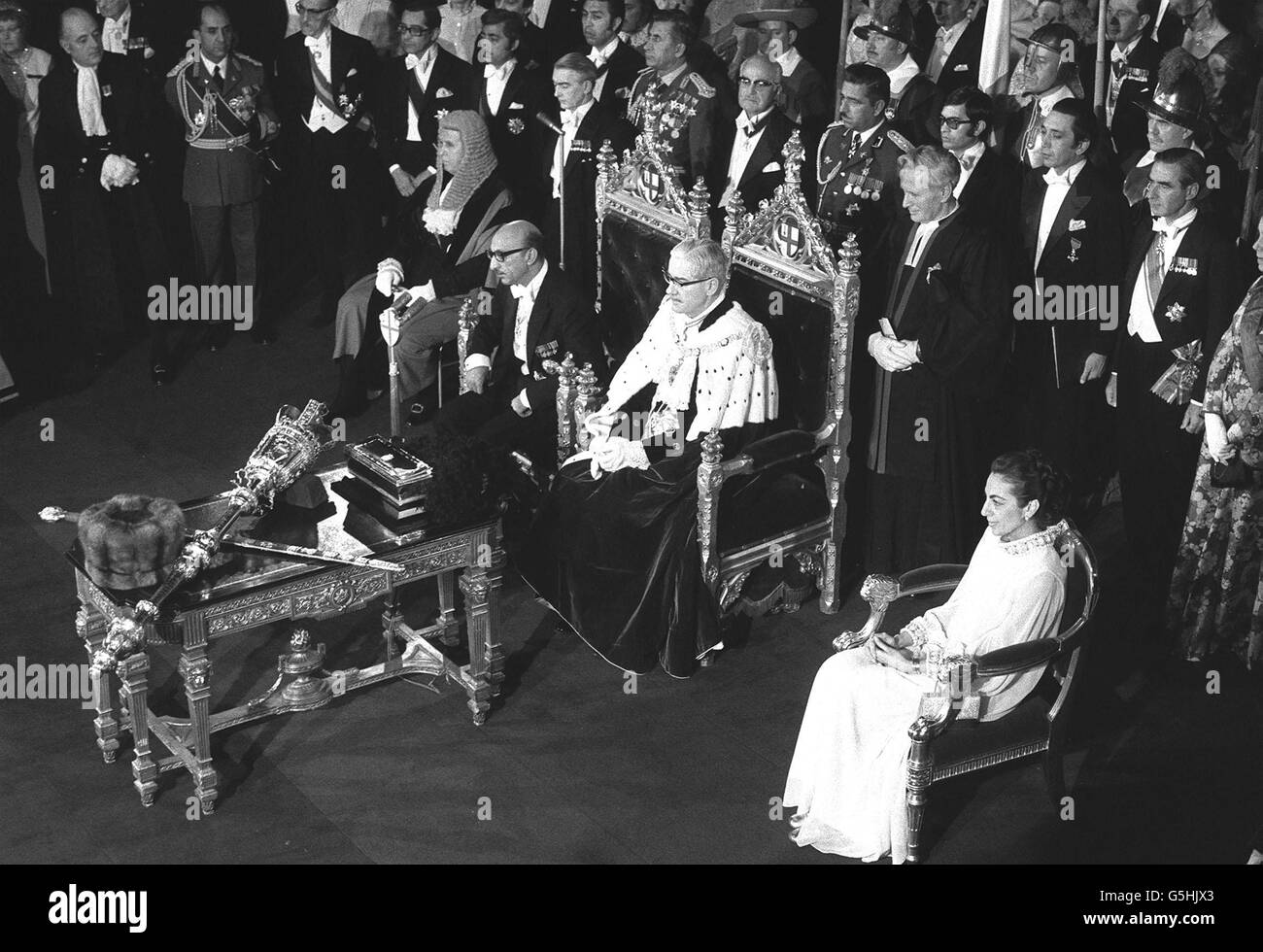 Seated in front of the standing guests are (from left) the town clerk, the King of Afghanistan, the Lord Mayor (Sir Edward Howard) and Princess Bilquis. The Lord Mayor welcomed the King and Princess to a reception and banquet at the City Hall. * .... Princess Alexandra and Mr Angus Ogidvy were among those present. Stock Photo
